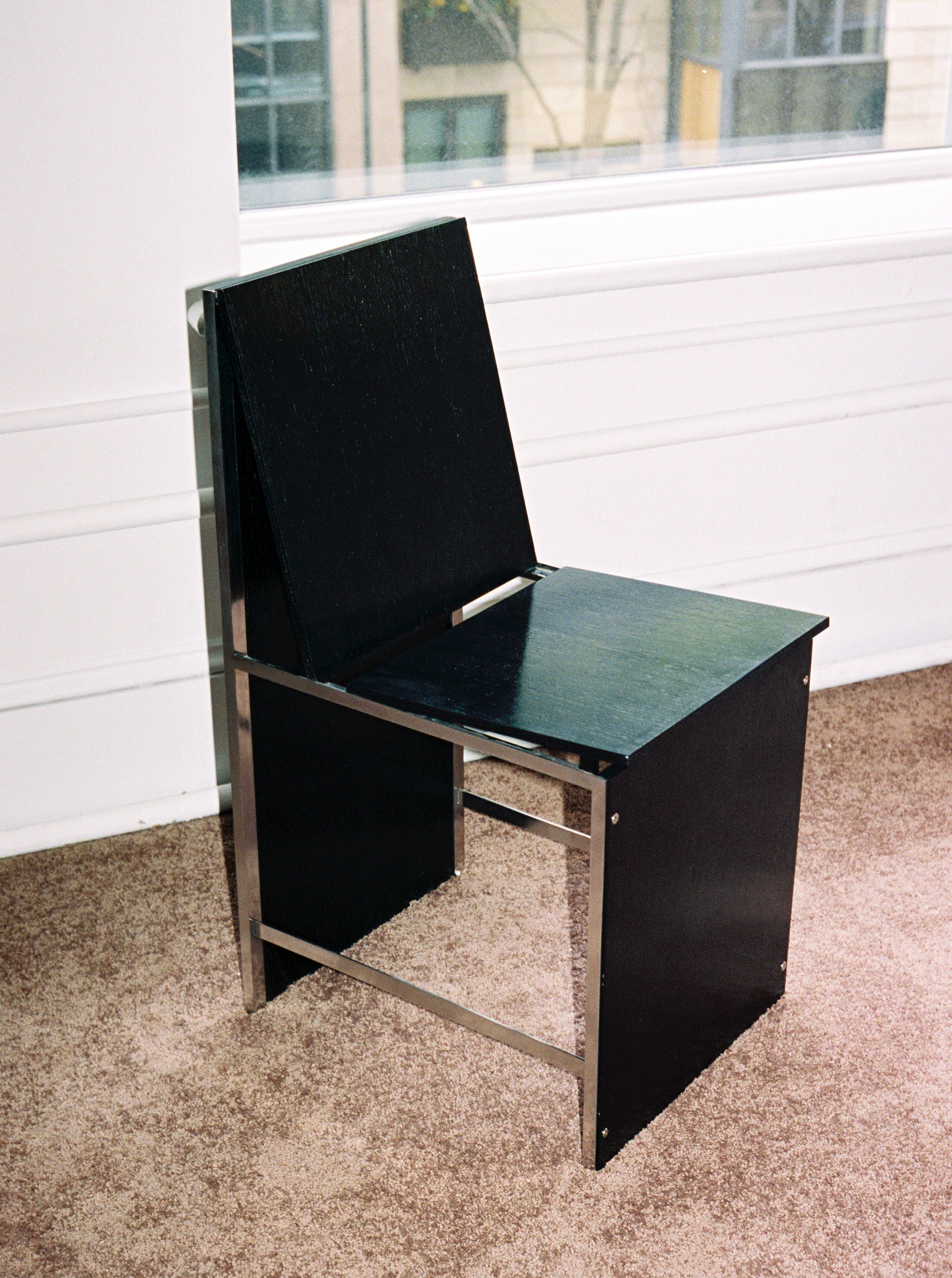 Black Chair 2022 in sleek modern design with comfortable cushioned seat and armrests