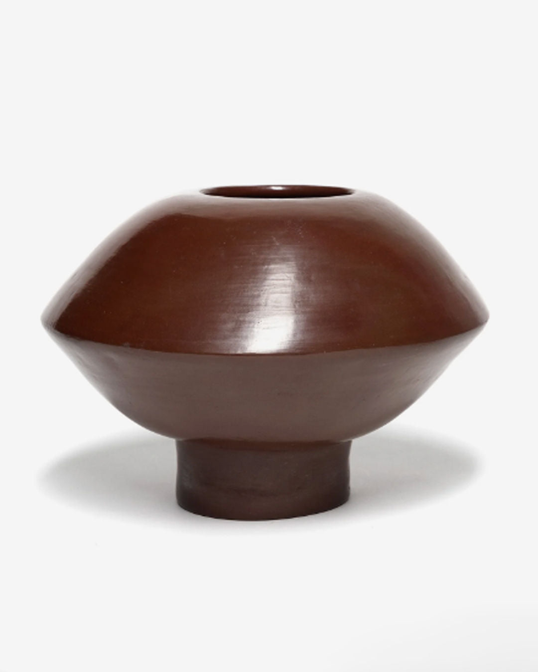 The ZAROLAT 'Ovni' Vase features a glossy, dark brown finish and a wide, rounded body that tapers to a narrow base, crafted from rich clay and set against a plain white background.