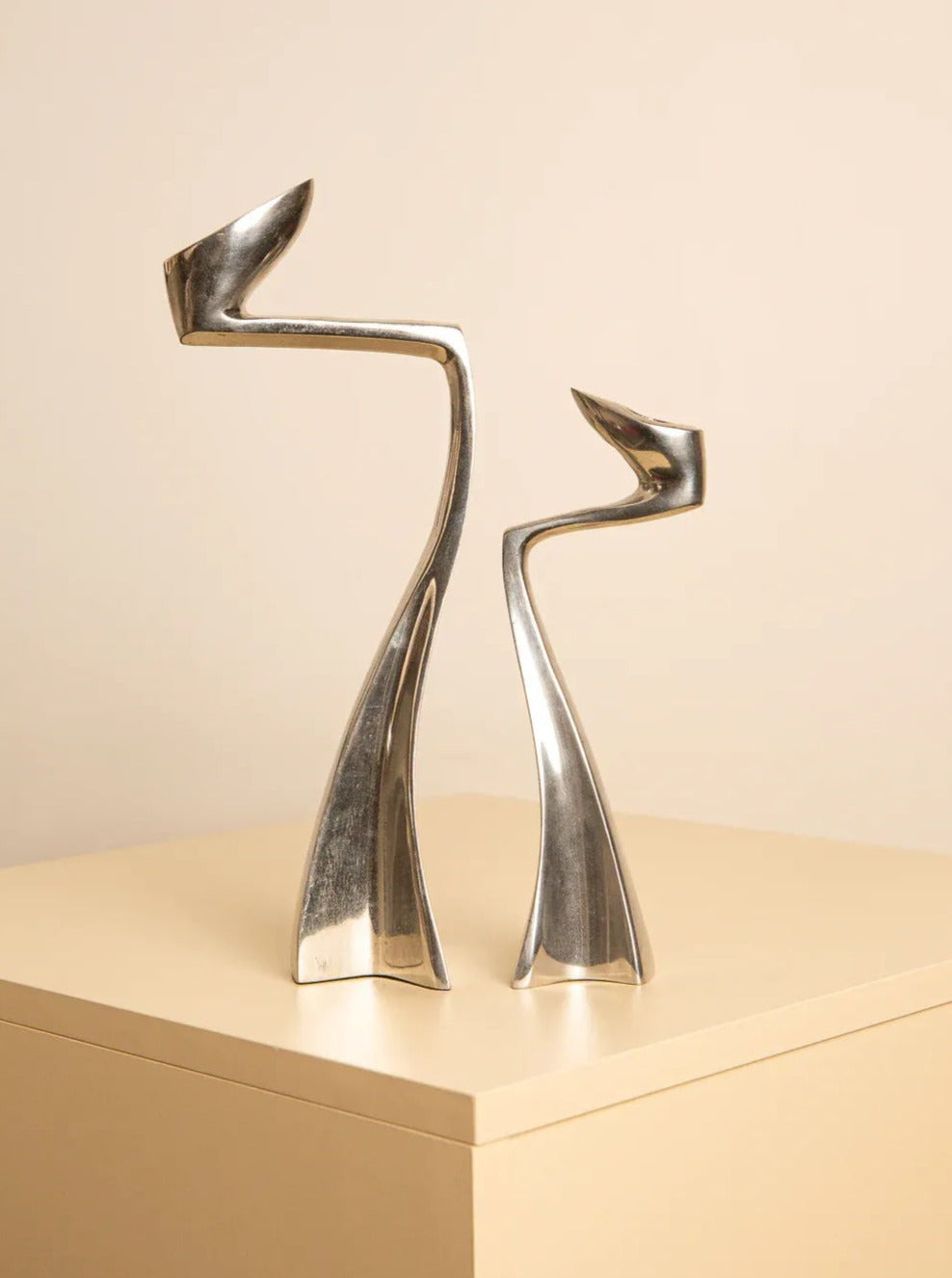 Pair of sleek and elegant candle holders designed by Matthew Hilton