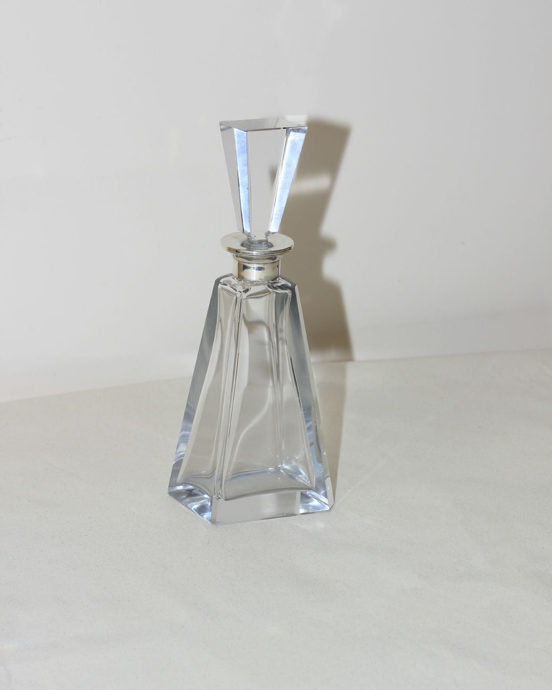 Art Deco crystal decanter with geometric stopper and faceted design