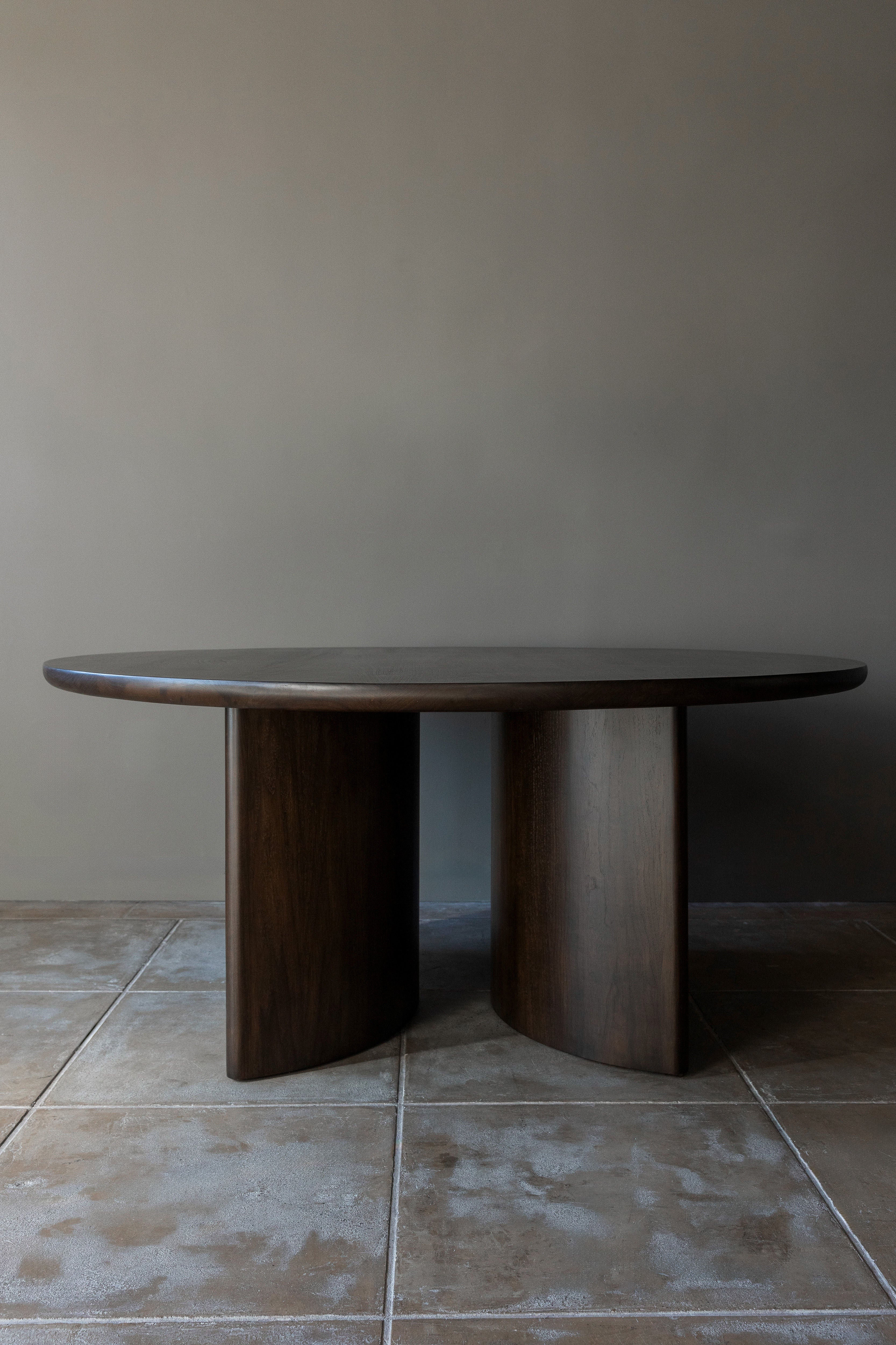 Wright round walnut dining table with curved pedestal base by Studio OSKLO