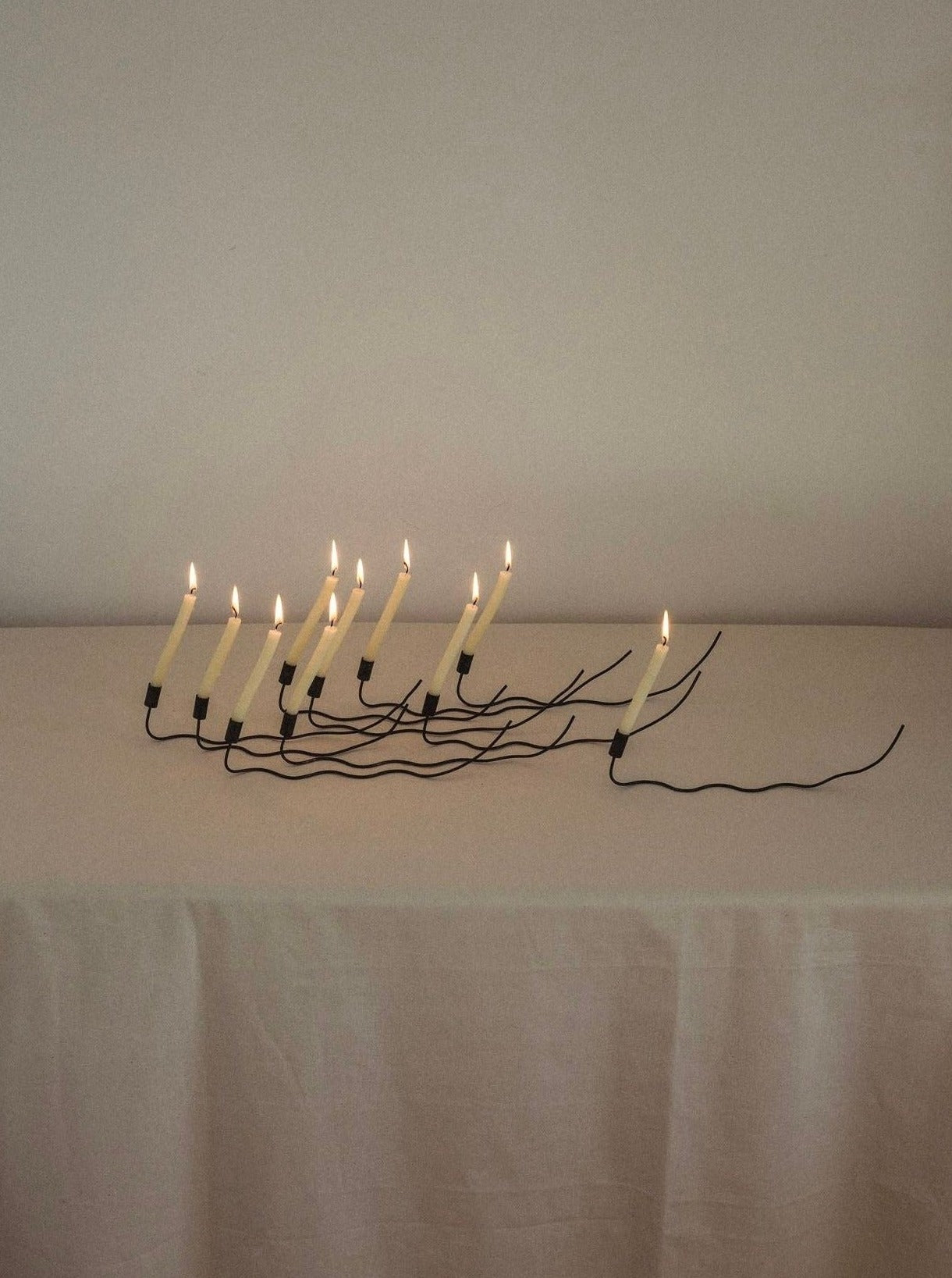 Going Home Candleholder: A decorative glass candleholder with a gold rim and intricate design