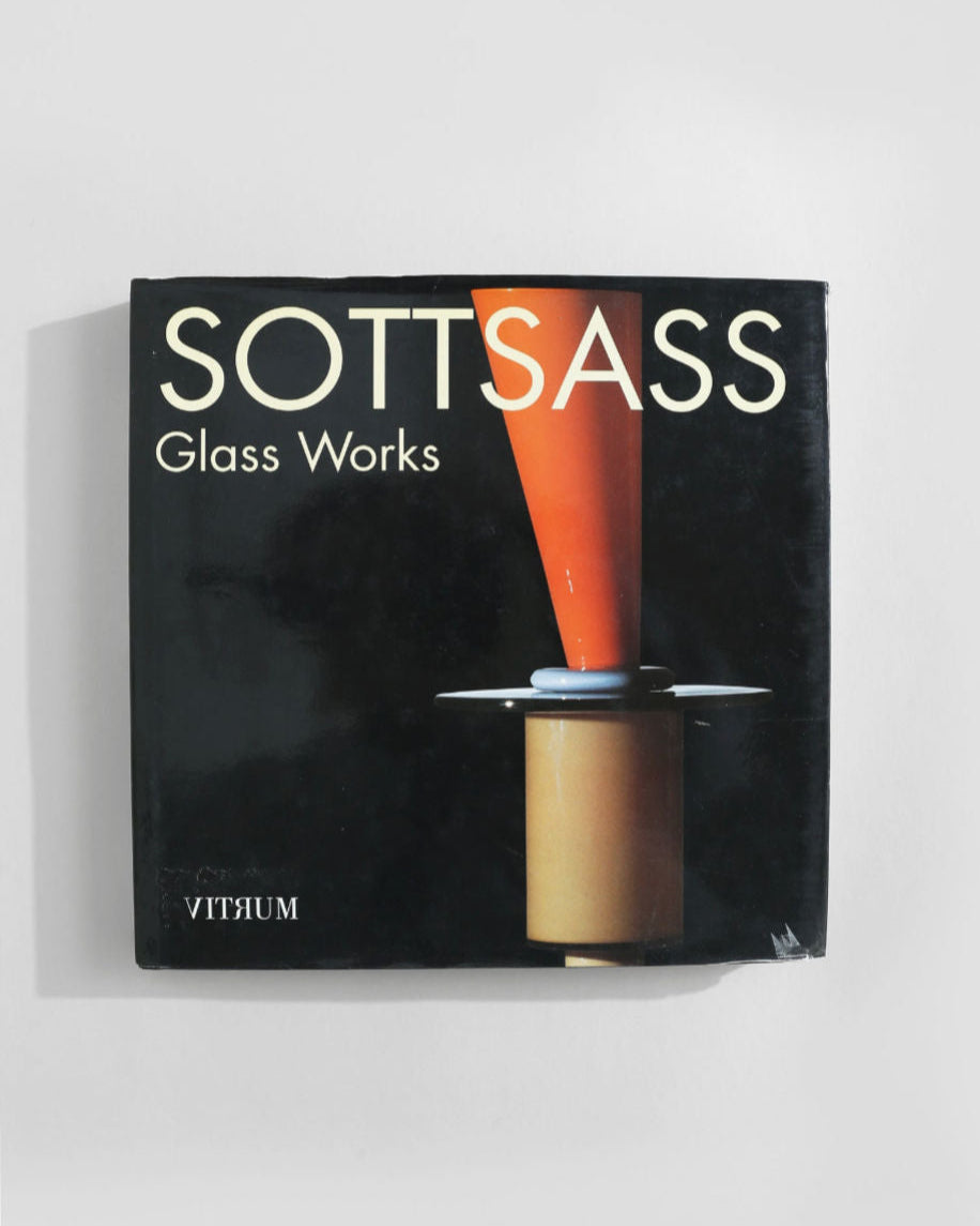 The "Ettore Sottsass, Glass Works Book" by Villa features abstract glass art on its dark cover, highlighted by a bold red and orange vertical design with "VITRIUM" upside down at the bottom left.