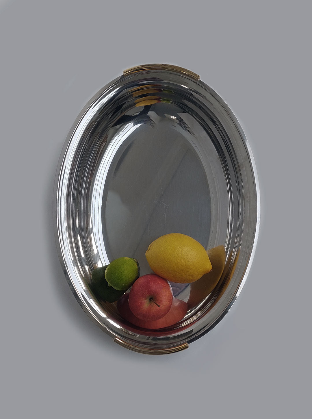 White ceramic large oval dish with intricate embossed design and scalloped edges