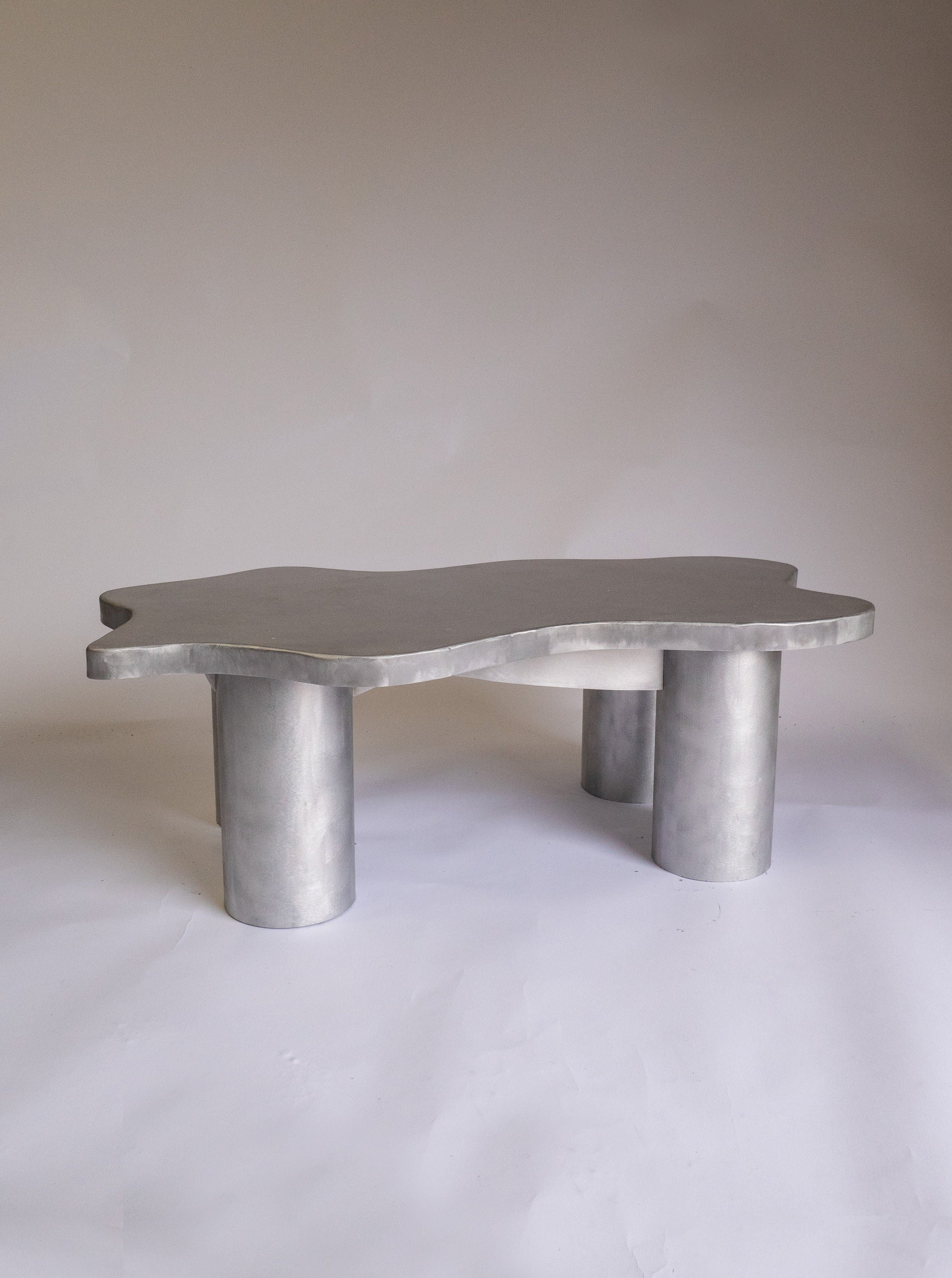 Modern glass coffee table with metal frame and wooden shelf