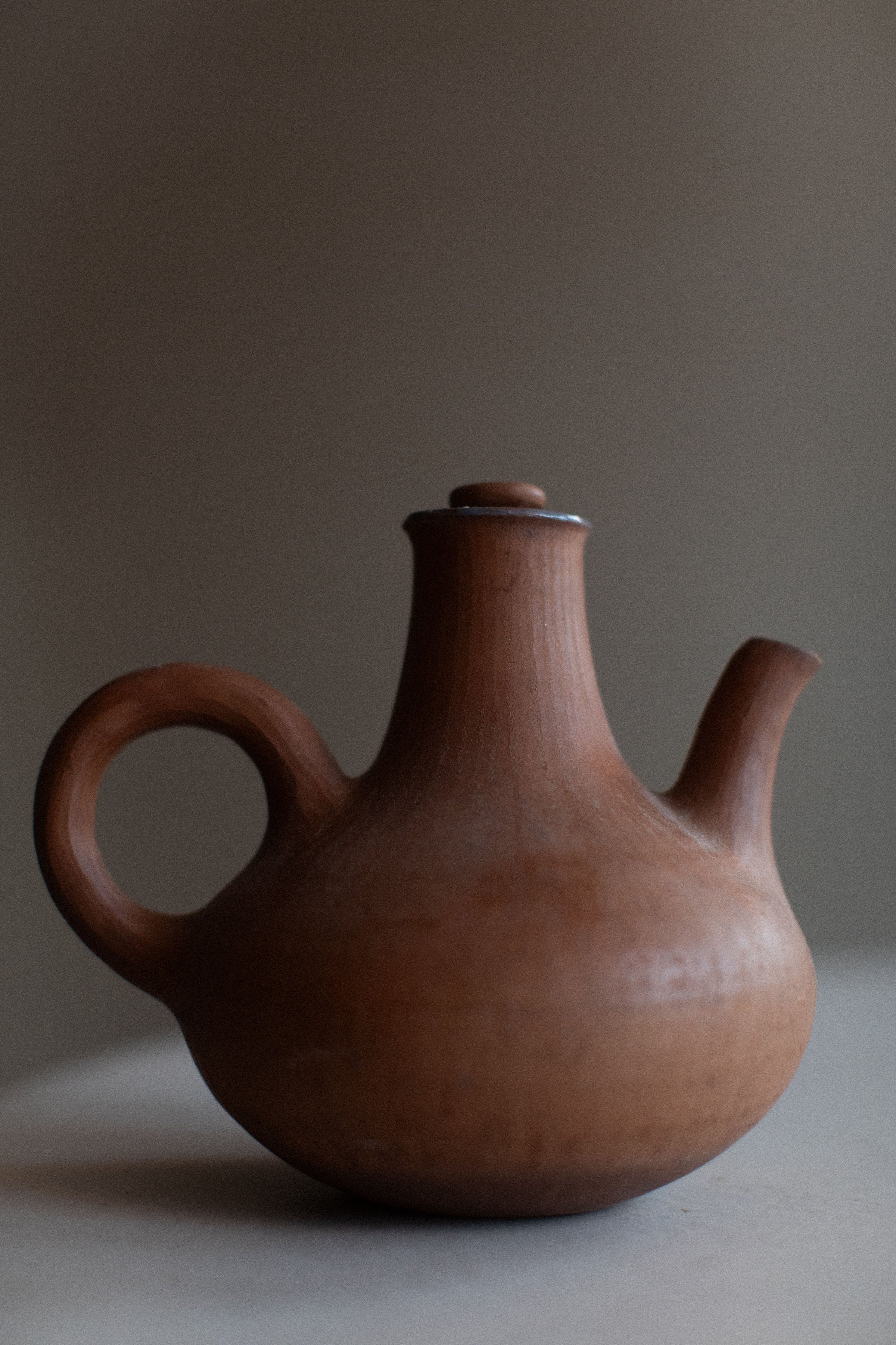 Ceramic teapot with floral design and handle, perfect for afternoon tea