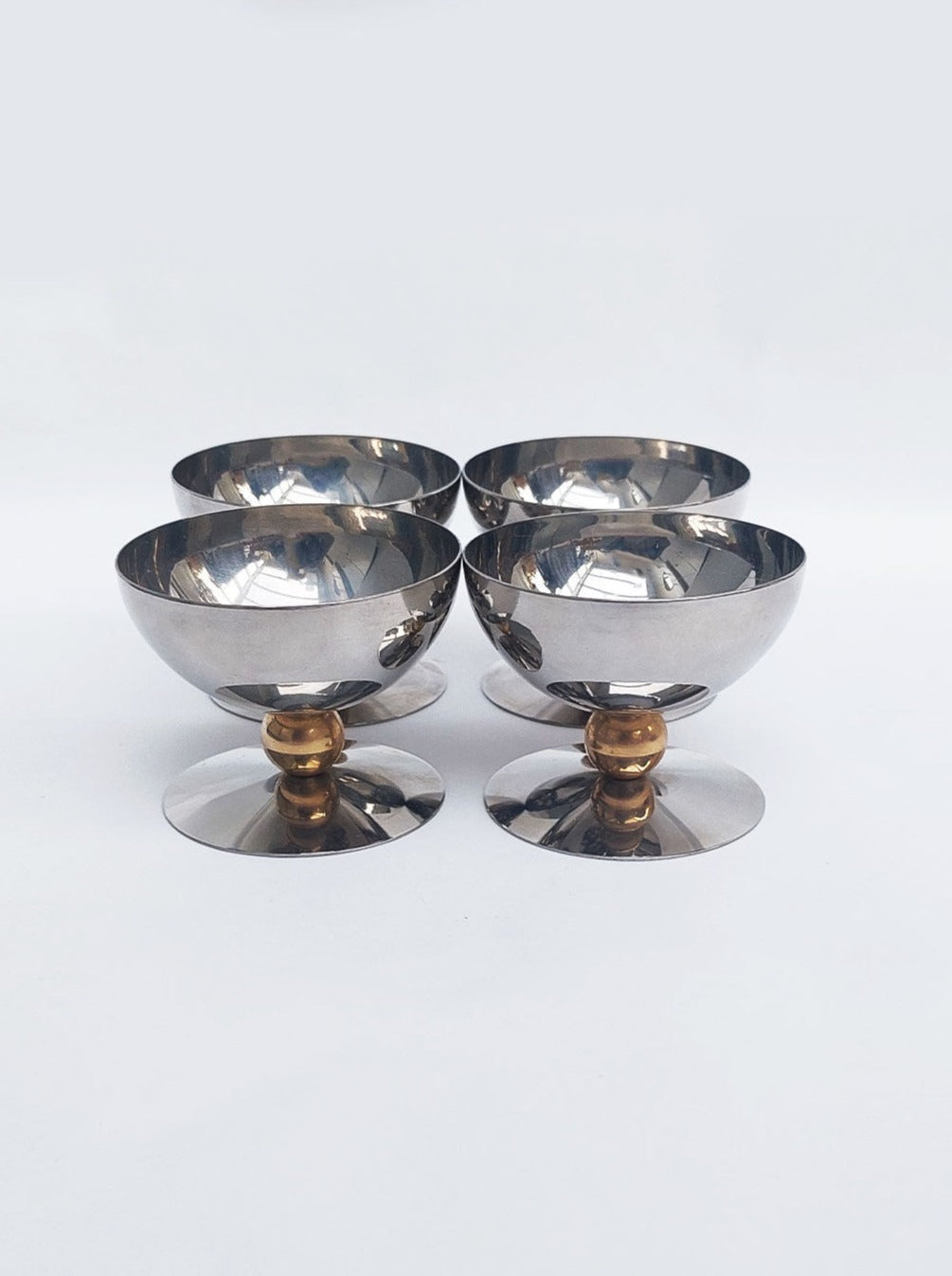 Set of 4 colorful ceramic ice cream cups with matching spoons, perfect for serving delicious frozen treats and desserts