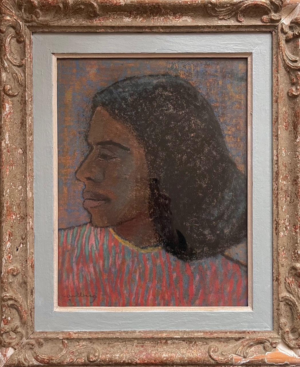 The Midcentury Portrait in Pastels by Médecine depicts a person with long dark hair in profile facing left, against a textured muted-toned background. They wear a vertically striped red and white shirt, set in an ornately weathered antique frame by this Swedish artist.