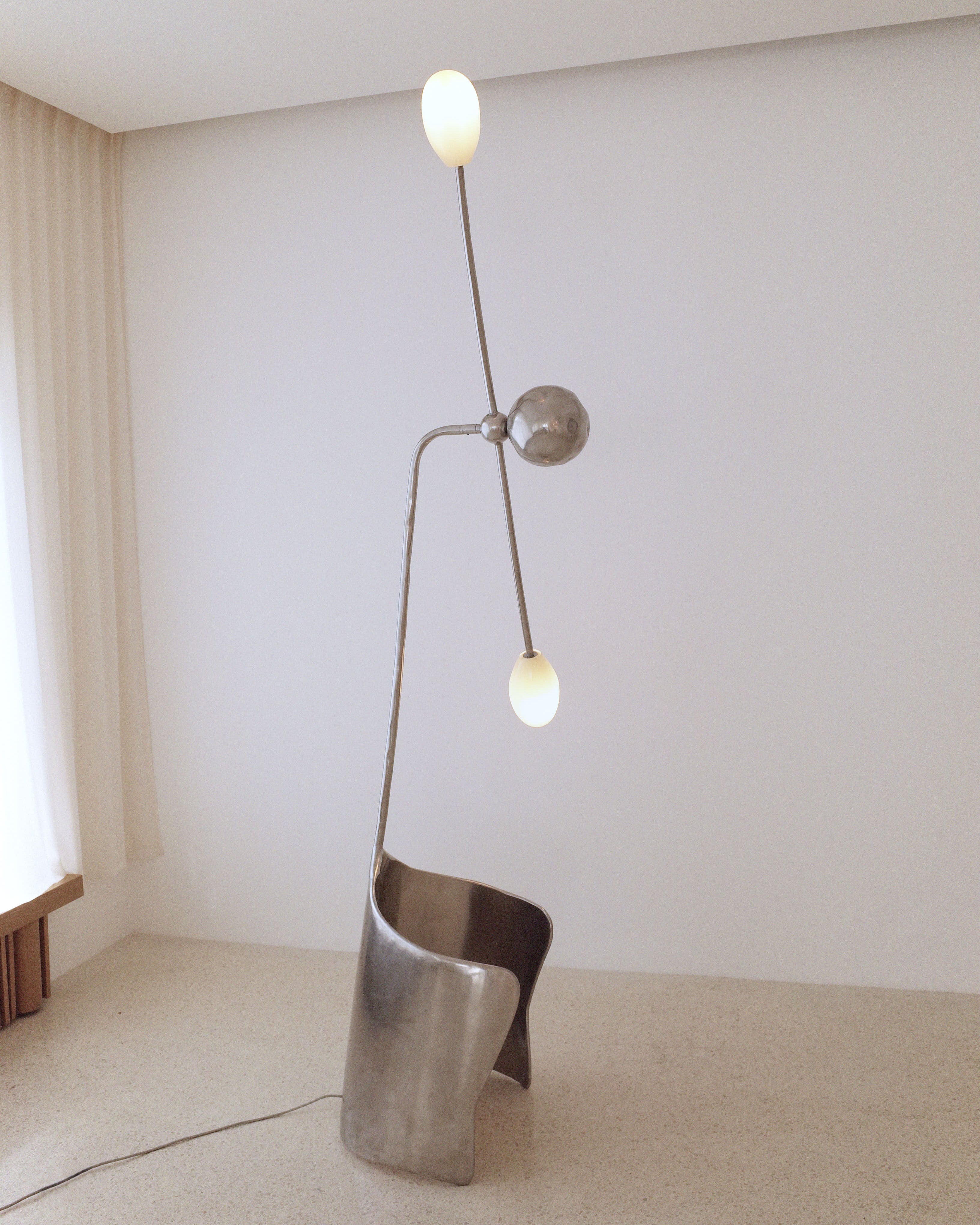 The MOULIN Floor Lamp in Polished Stainless Steel