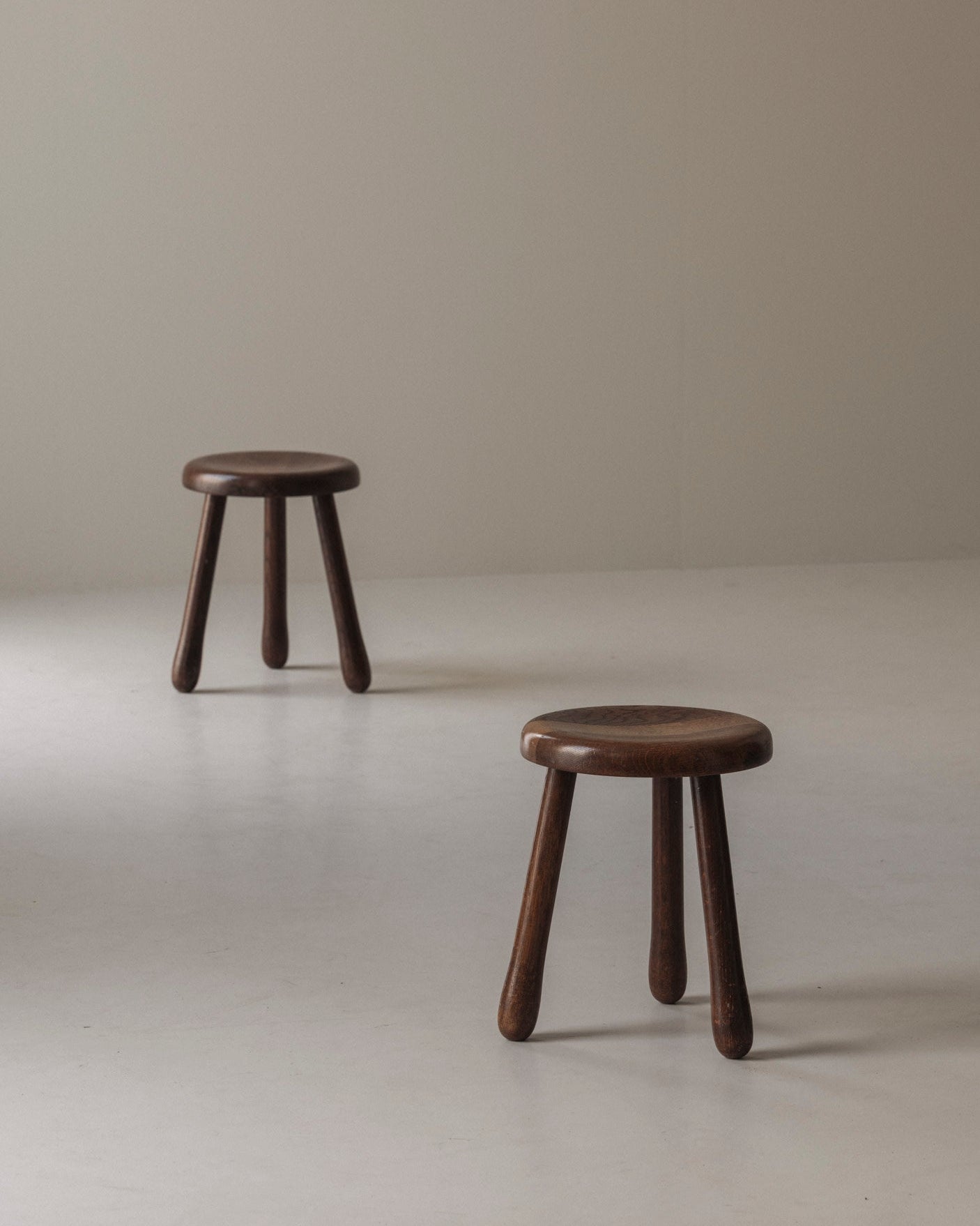 Set of Two Tripod Solid Elm Stools, France 1960s — side angle
