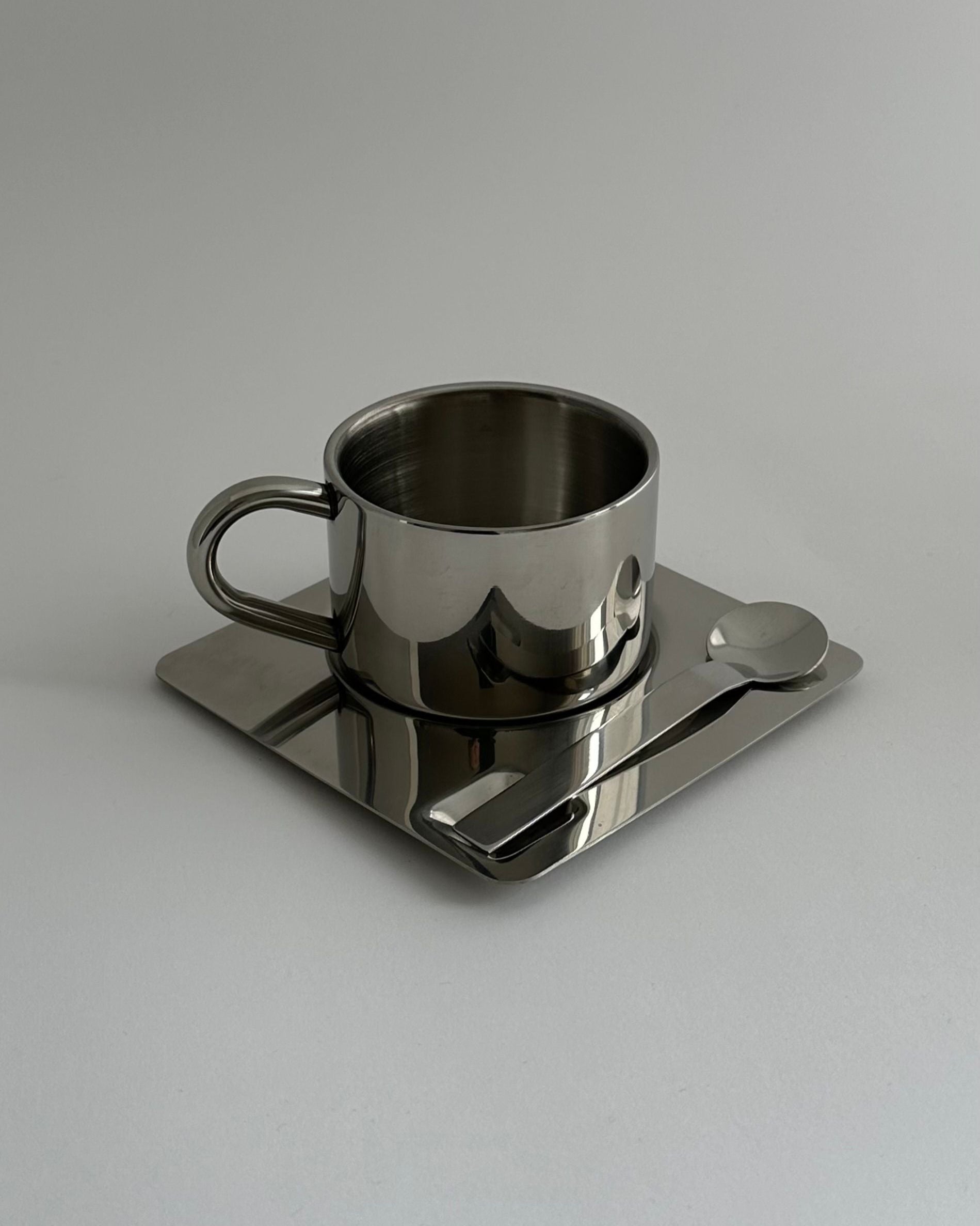 'HEDONISM' stainless steel cup with saucer by CARRARA Studio | The Oblist