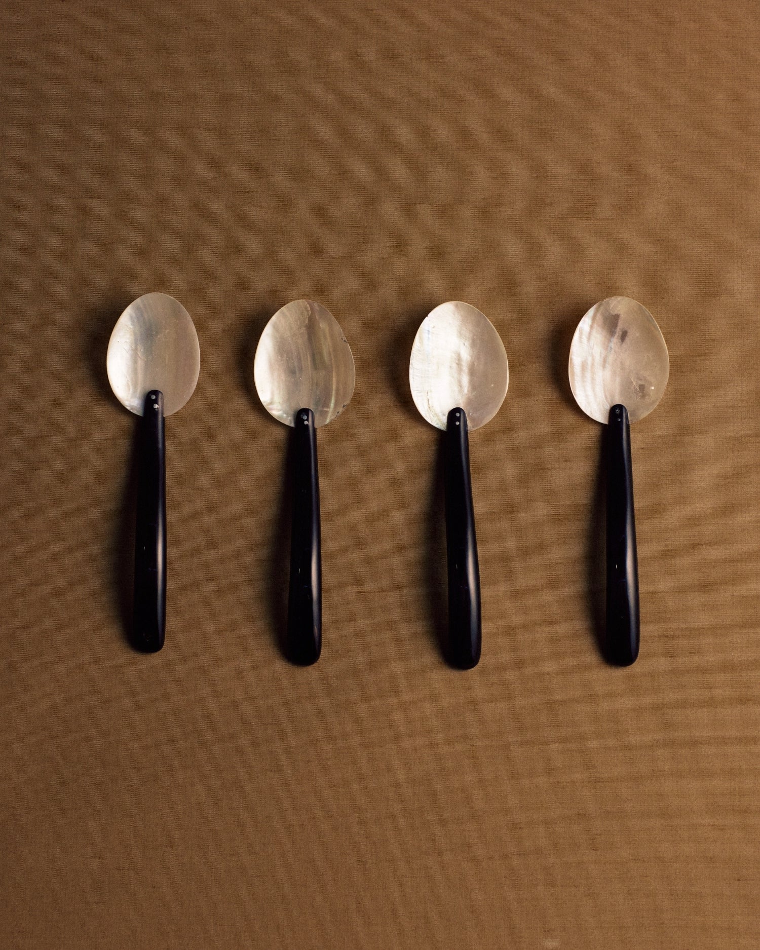 Mother Of Pearl And Bakelite Spoons — side angle