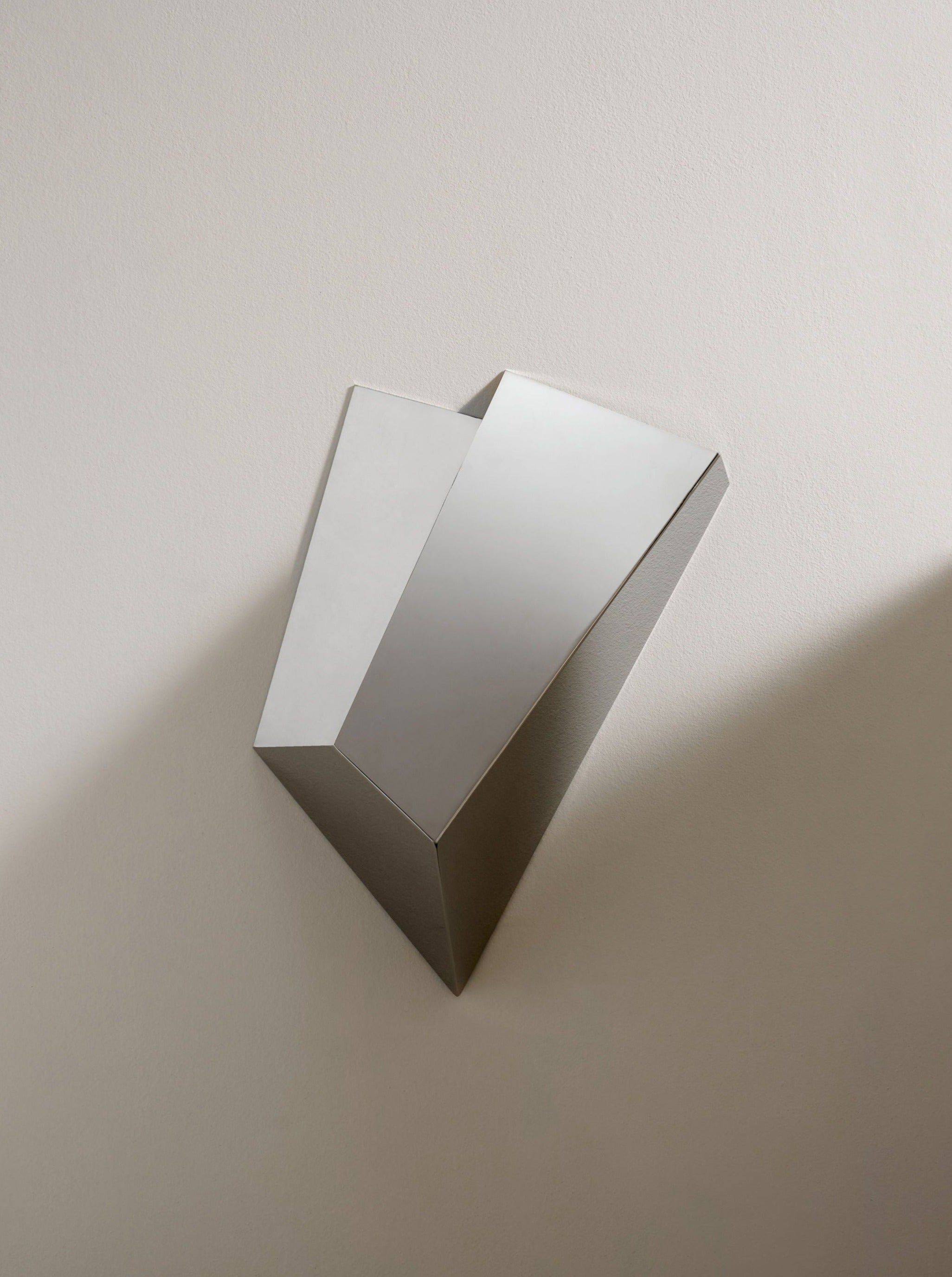 Katoptris Nickel Wall Light — angled view highlighting reflective surface