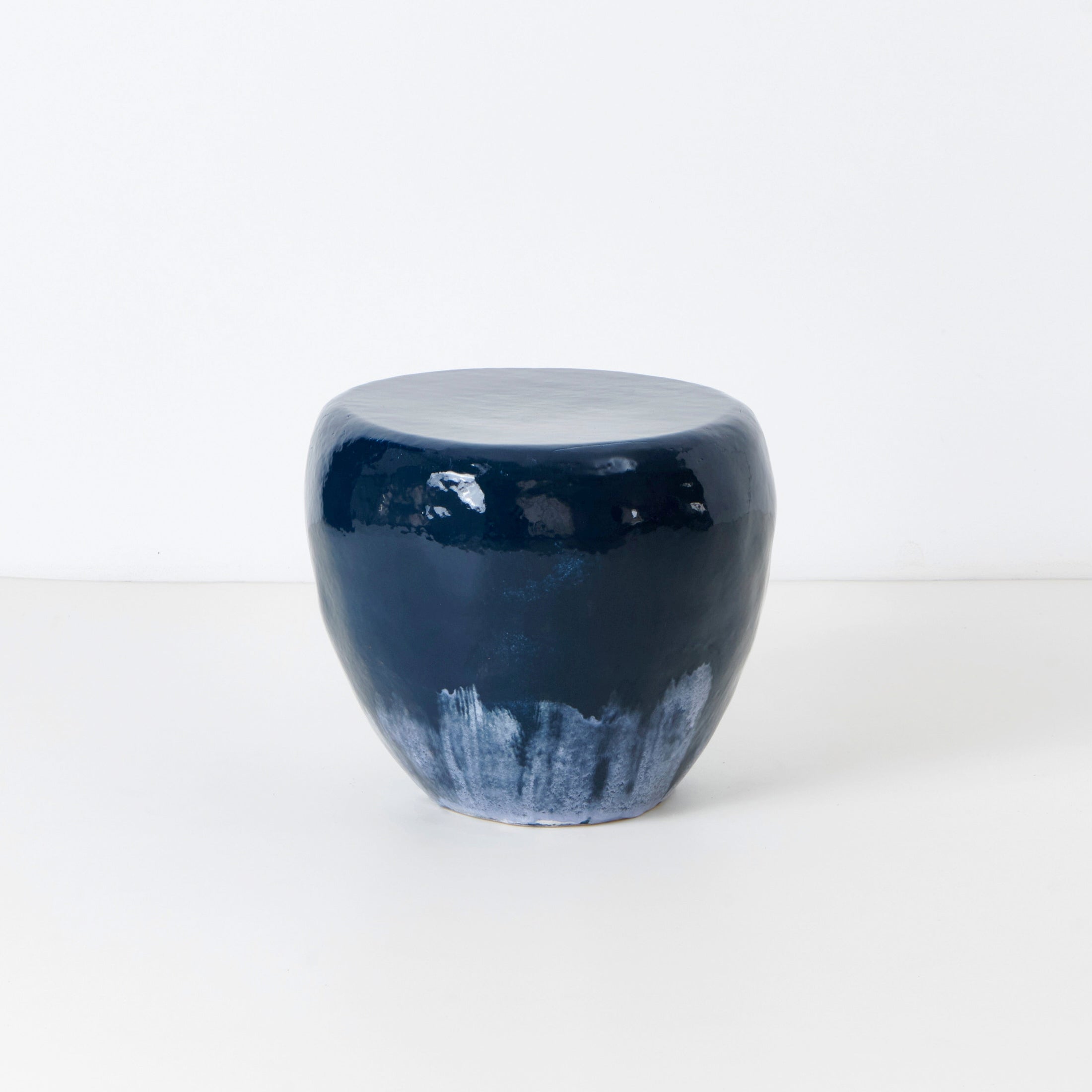 Medium Ceramic Side Table — side view of glossy navy finish