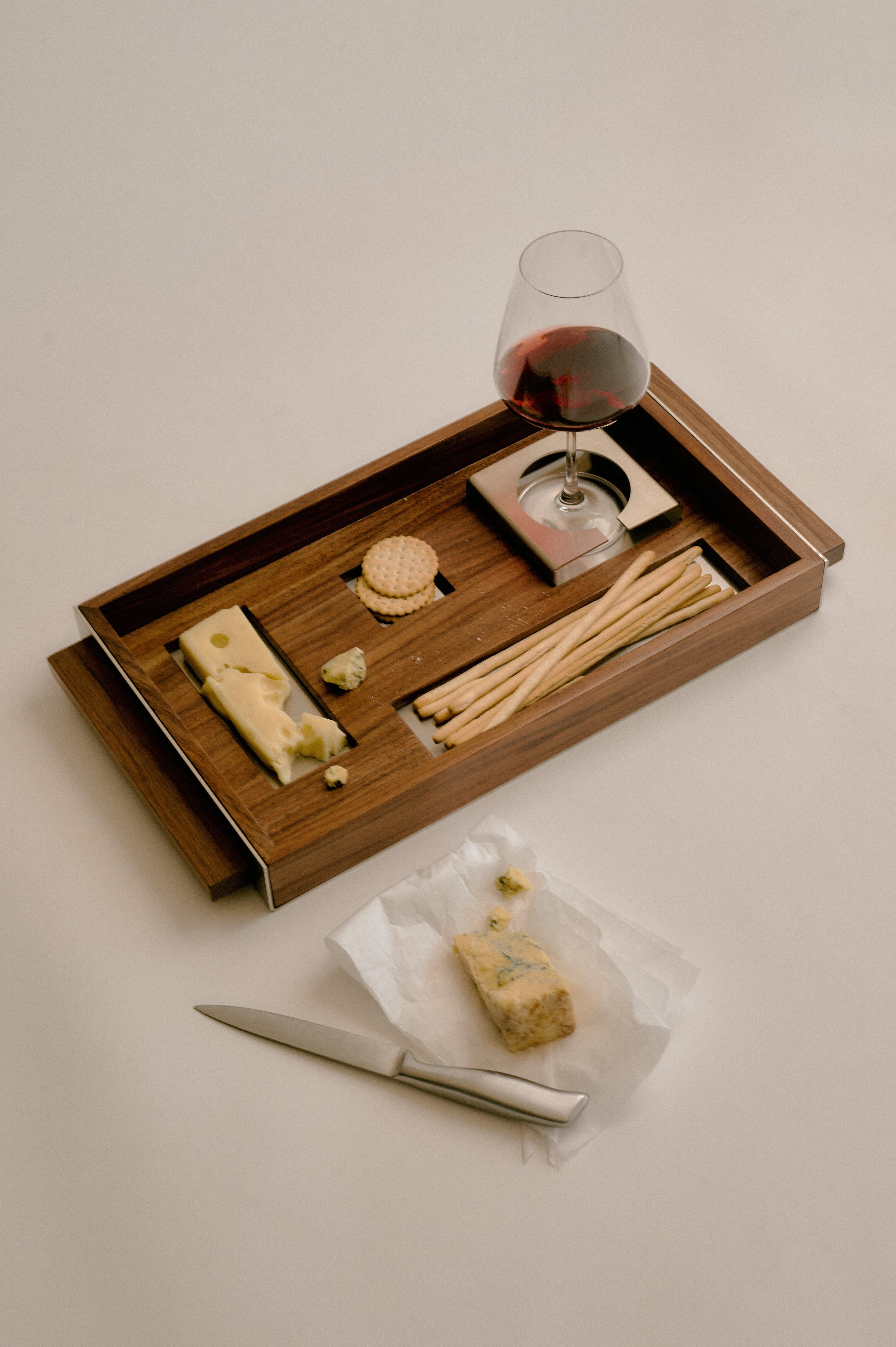 T4 wooden serving tray with wine glass, cheese and crackers