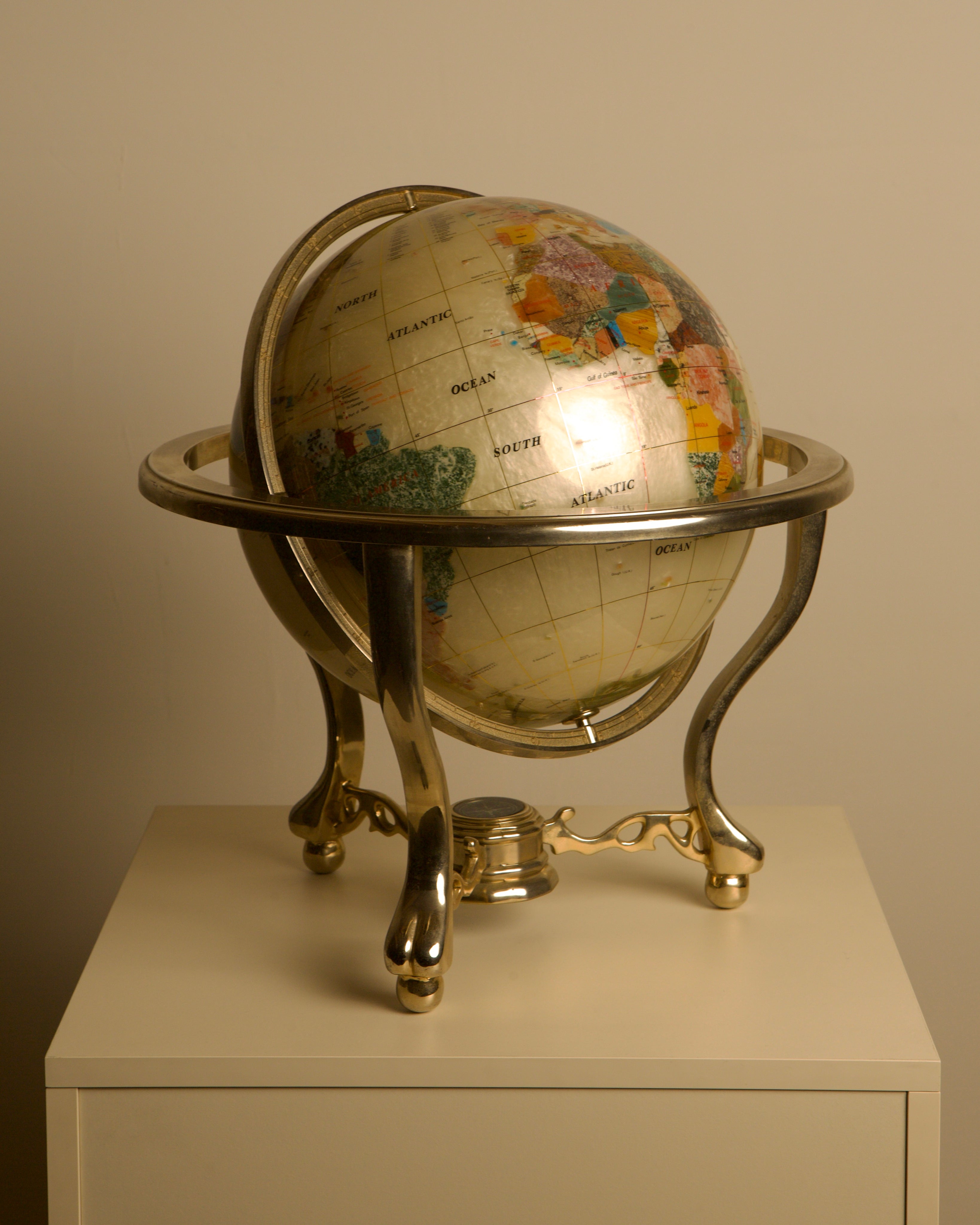 Large Globe Made of Hardstone and Mother-of-pearl, 1970s by Treaptyque | The Oblist — vintage globe with metallic stand