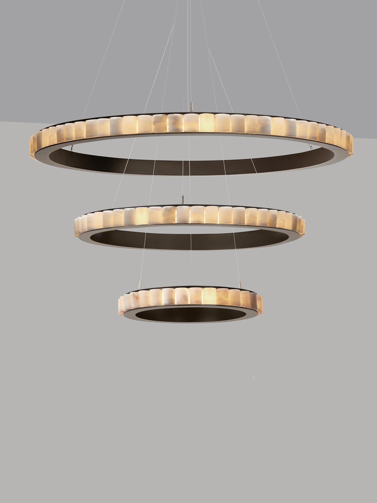 AVALON Triple Chandelier With Ceiling Rose — close-up of circular pendant rings in warm tones