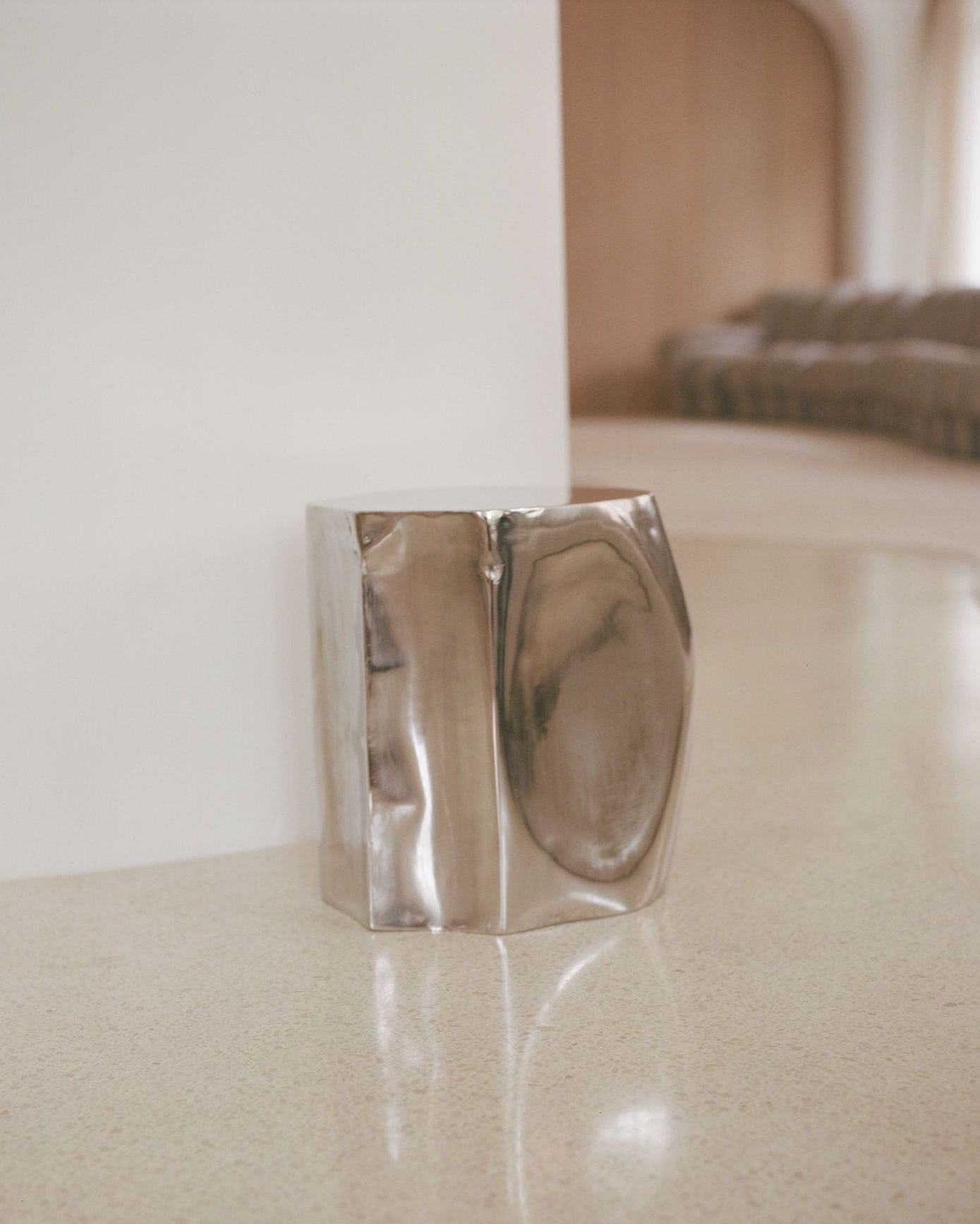 The ROCHER Small Table in Polished Stainless Steel