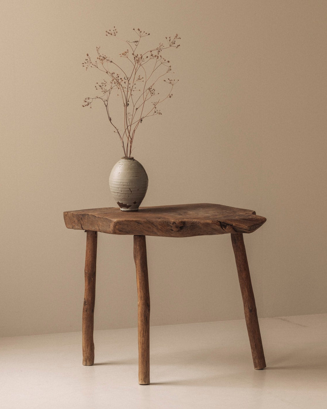 Sculptural French tripod side table in solid elm dating from the 1950s. by Modern Living | The Oblist
