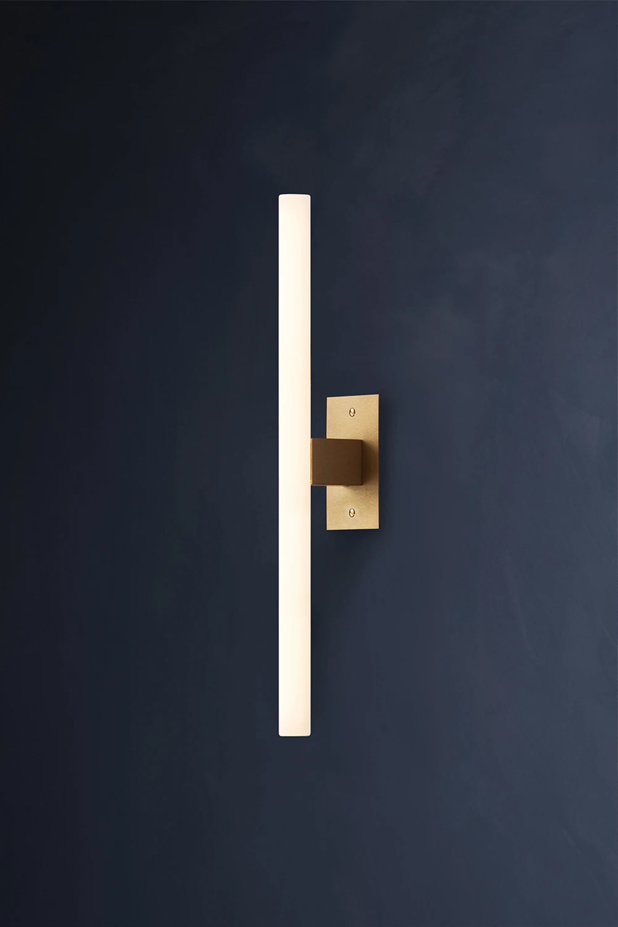 NEA WALL PLATE 50 — wall-mounted light against dark background