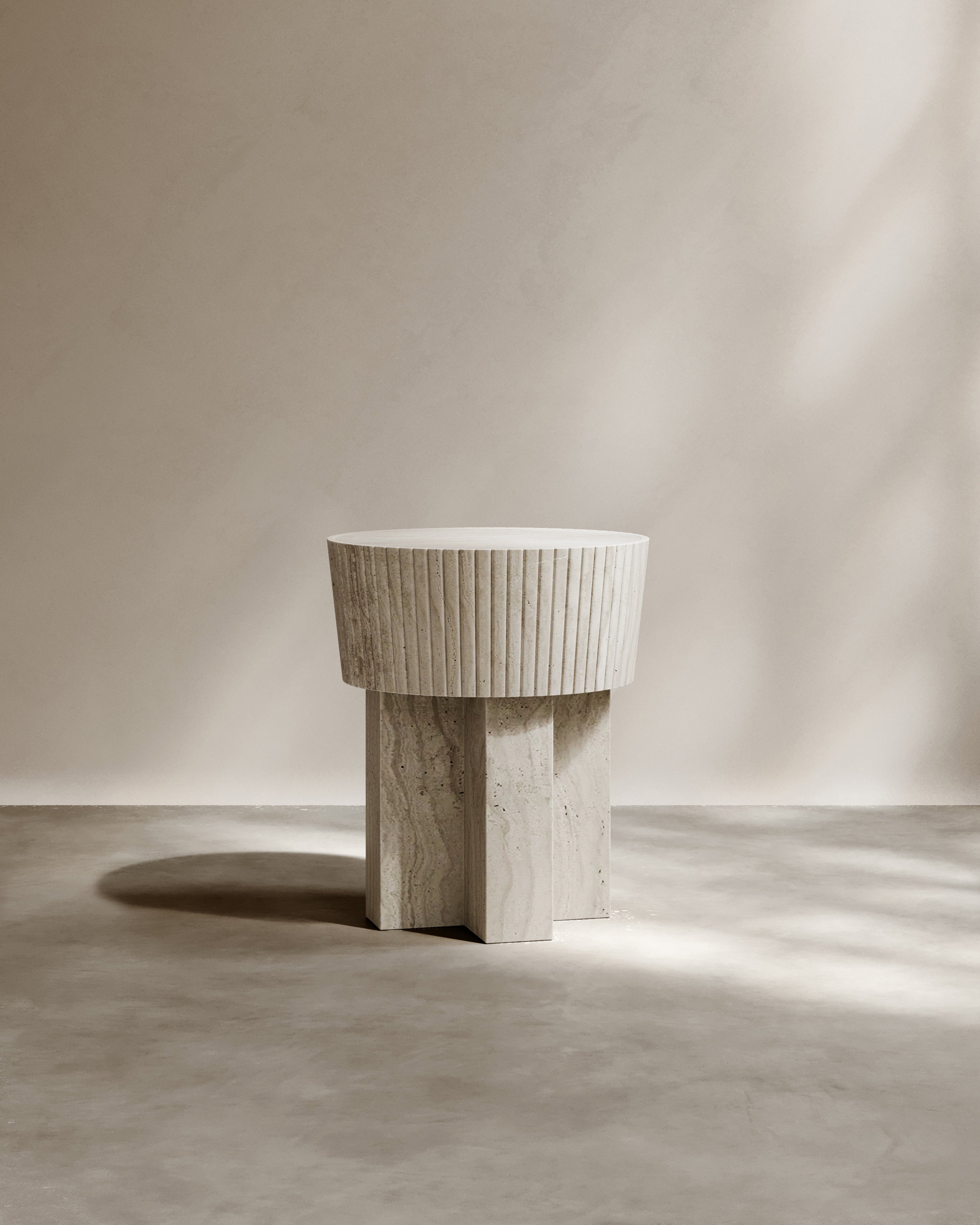 Modern travertine side table with fluted cylindrical top detail