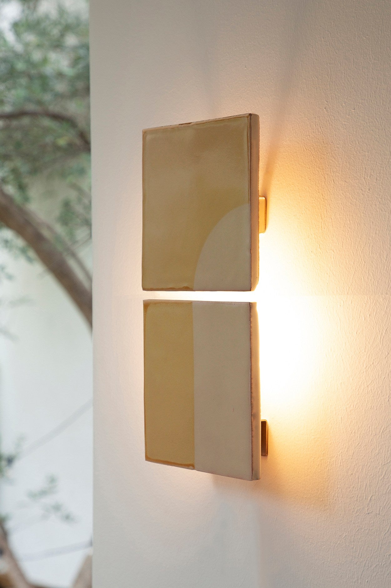 Modern brass wall sconce with geometric rectangular panels by Violaine d'Harcourt