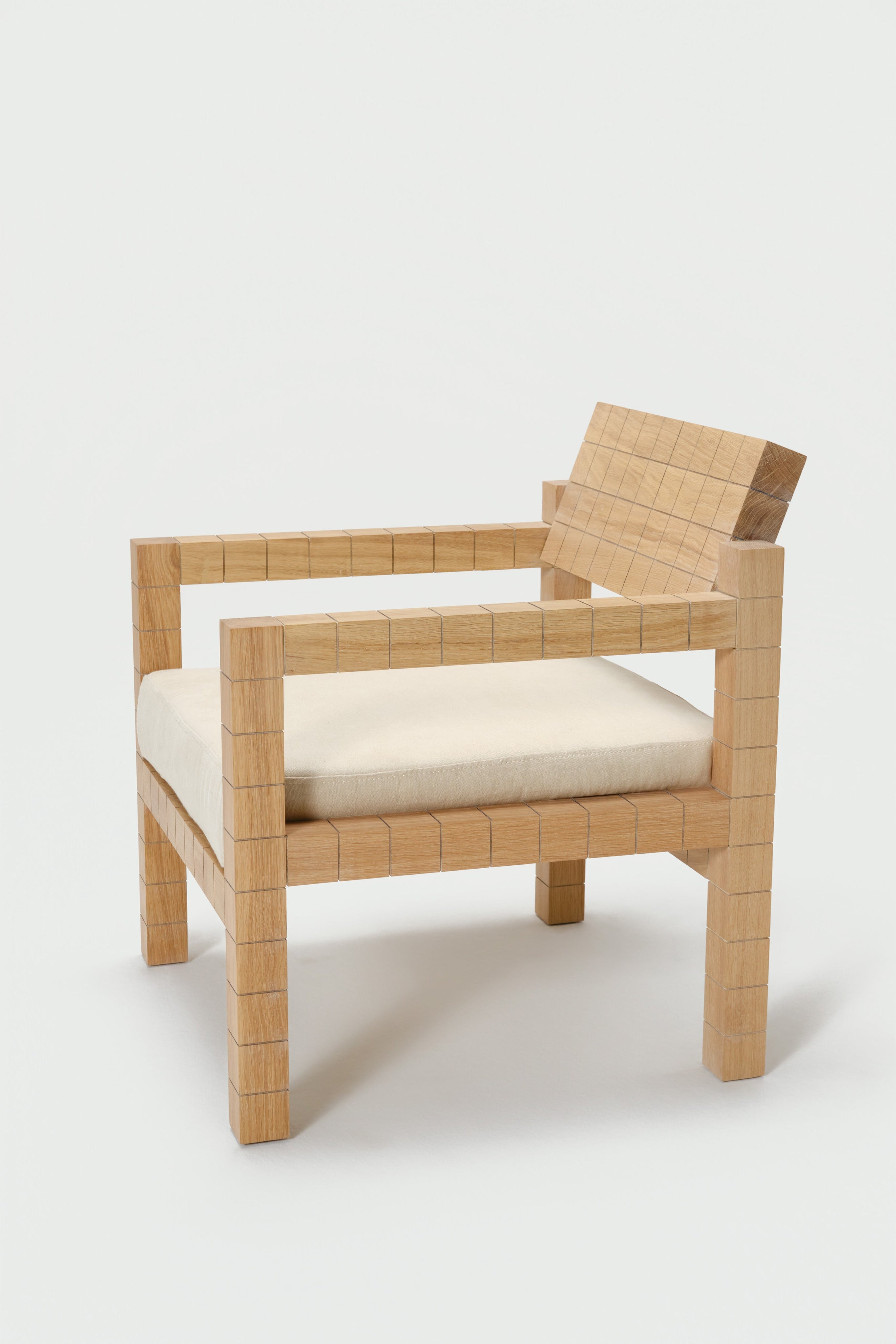 Mosaico Armchair — angled view highlighting natural wood texture
