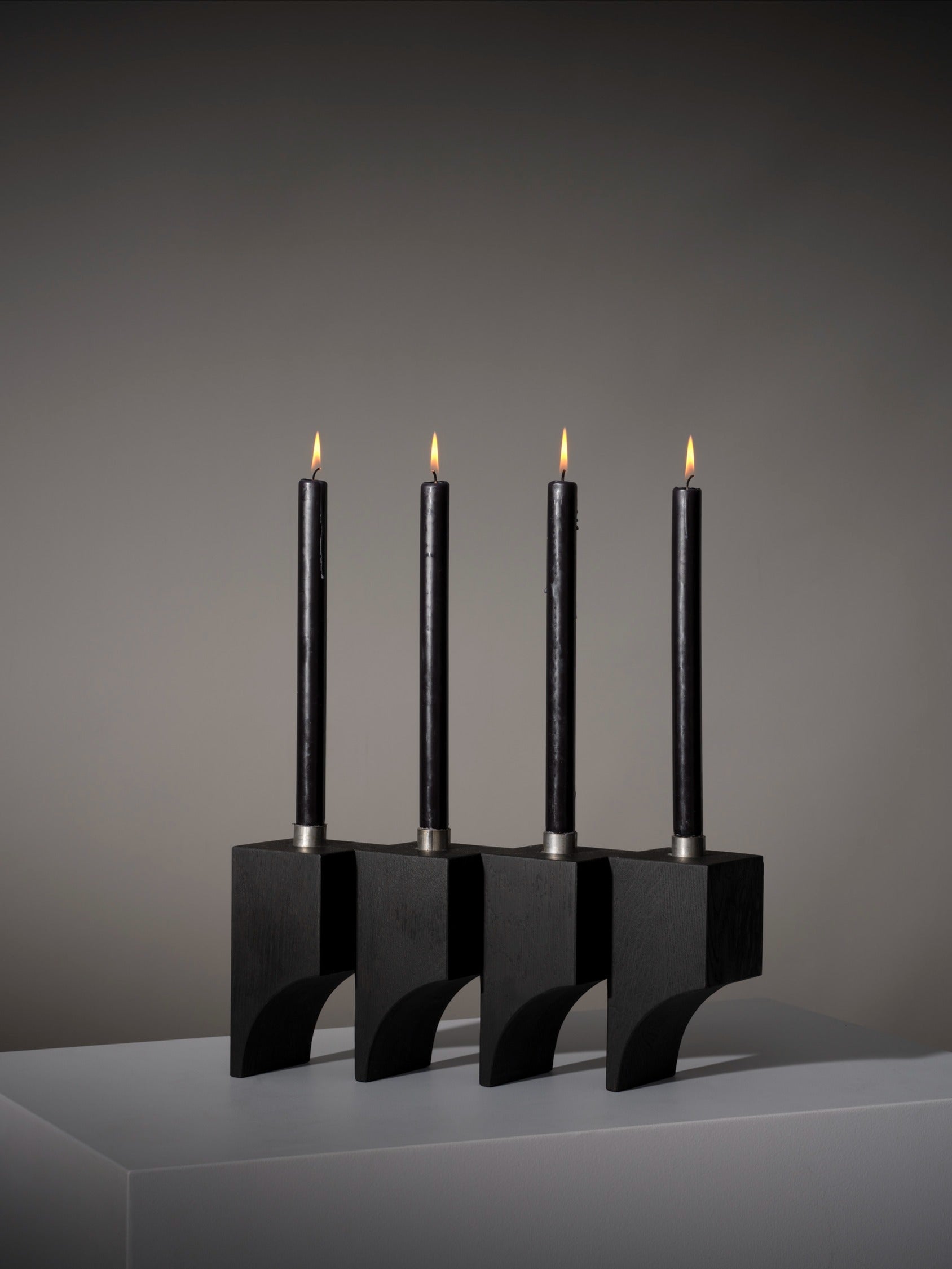 Acer Candle Holder R:4 — side view of black wooden holder with candles