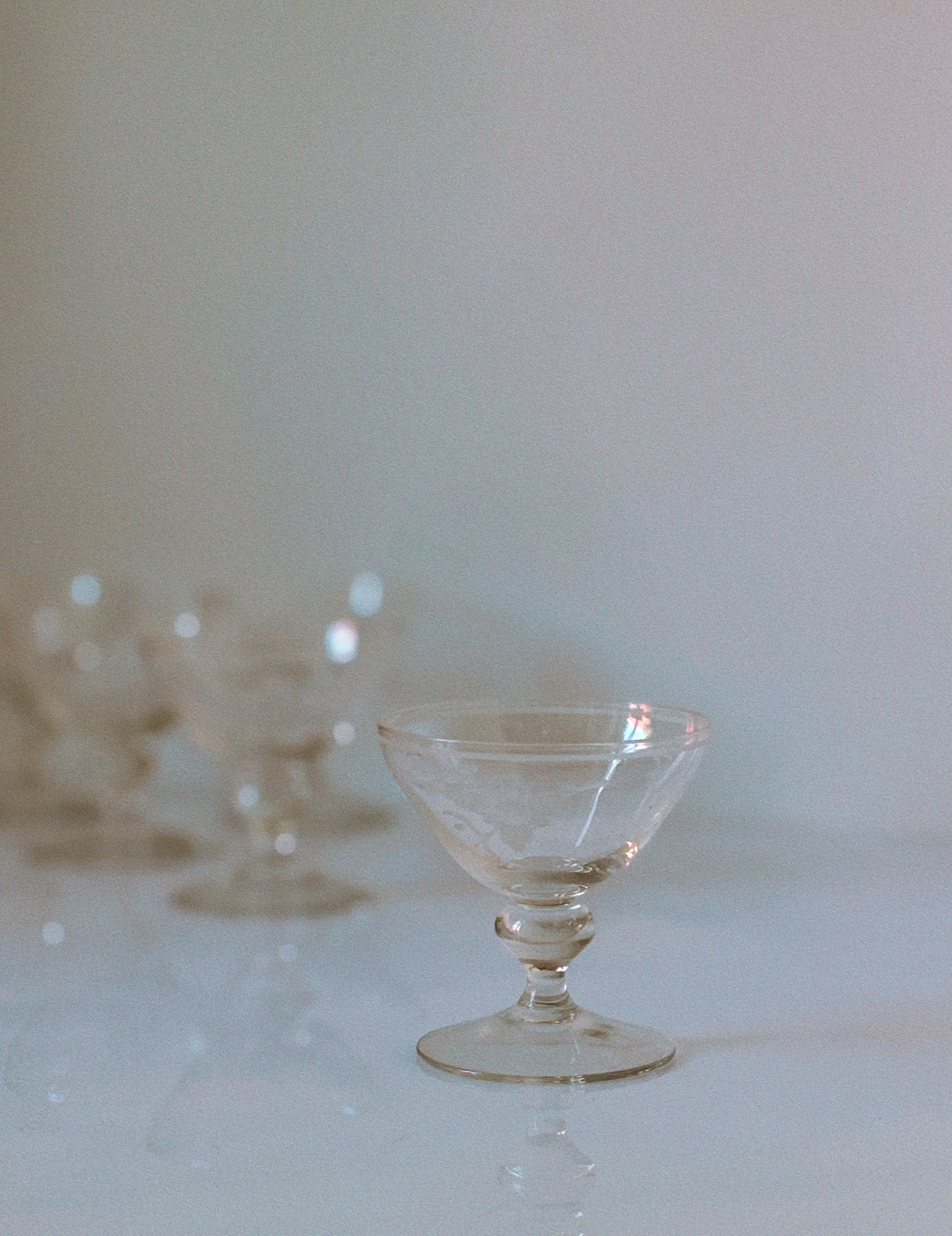 Clear etched floral dessert wine glass with ornate stem design