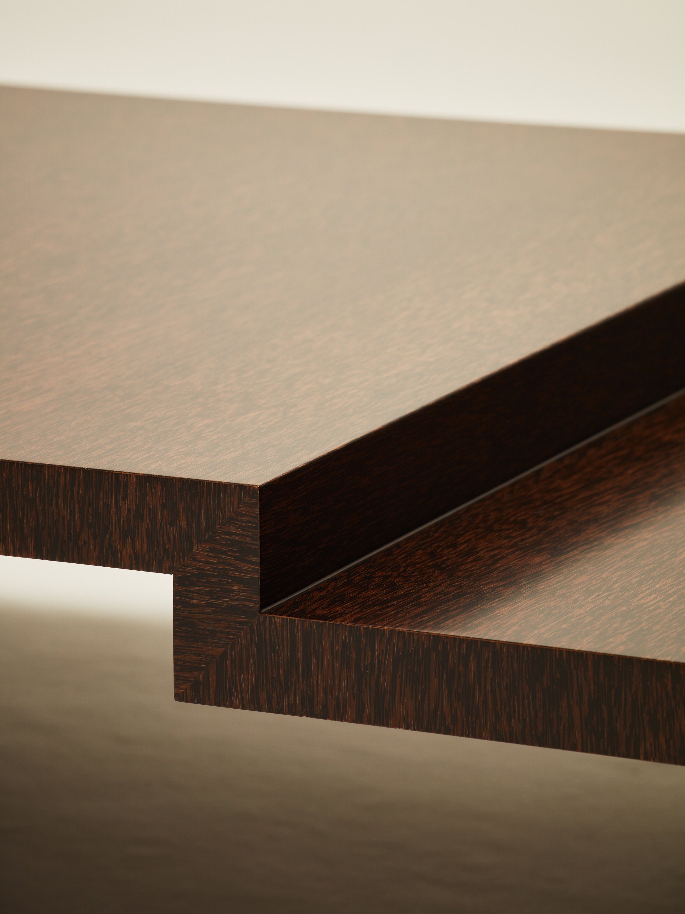 'Continuous' Coffee Table II Handcrafted in Wood Venner — side angle