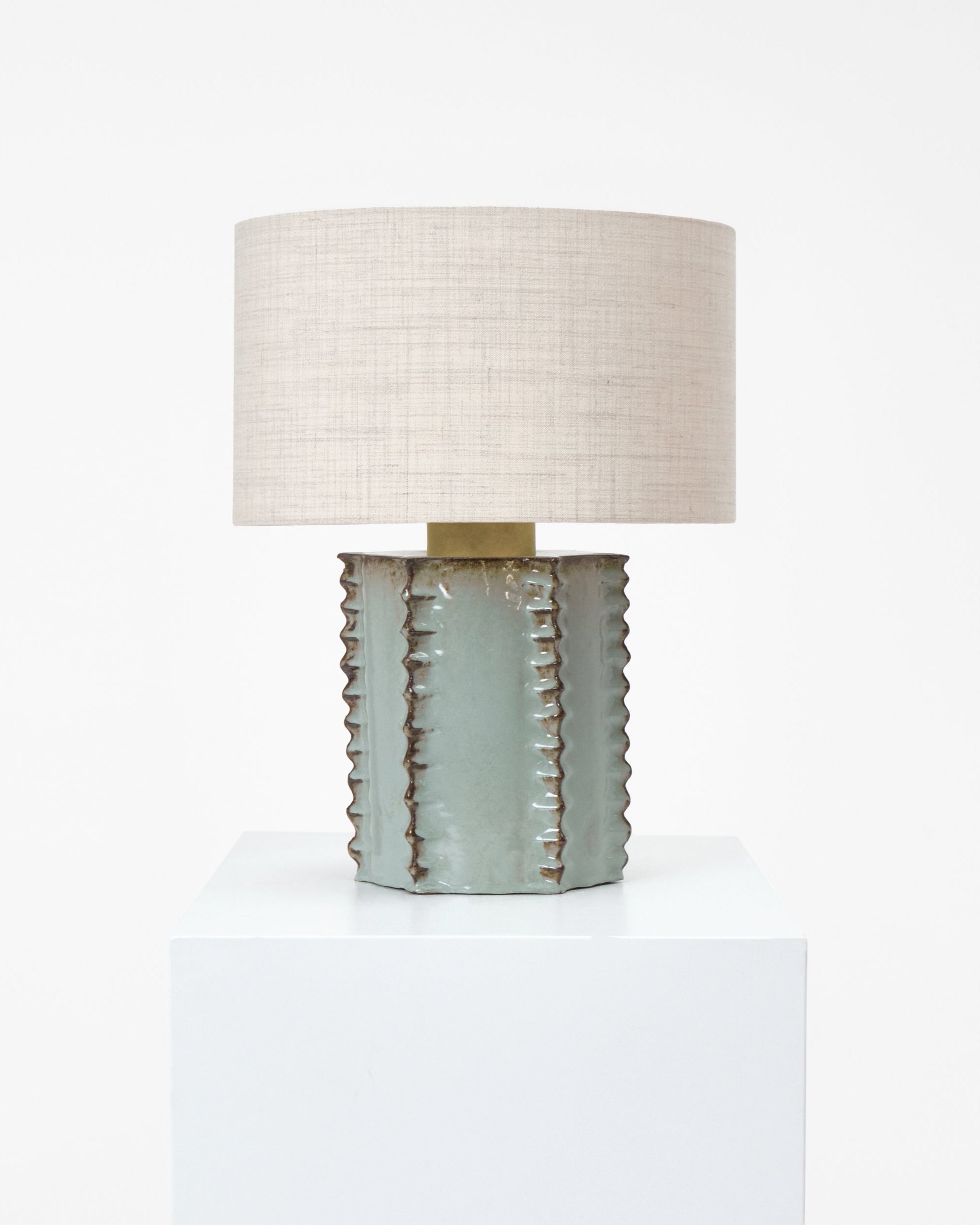 Totem Table Light — close-up of textured ceramic base with linen shade