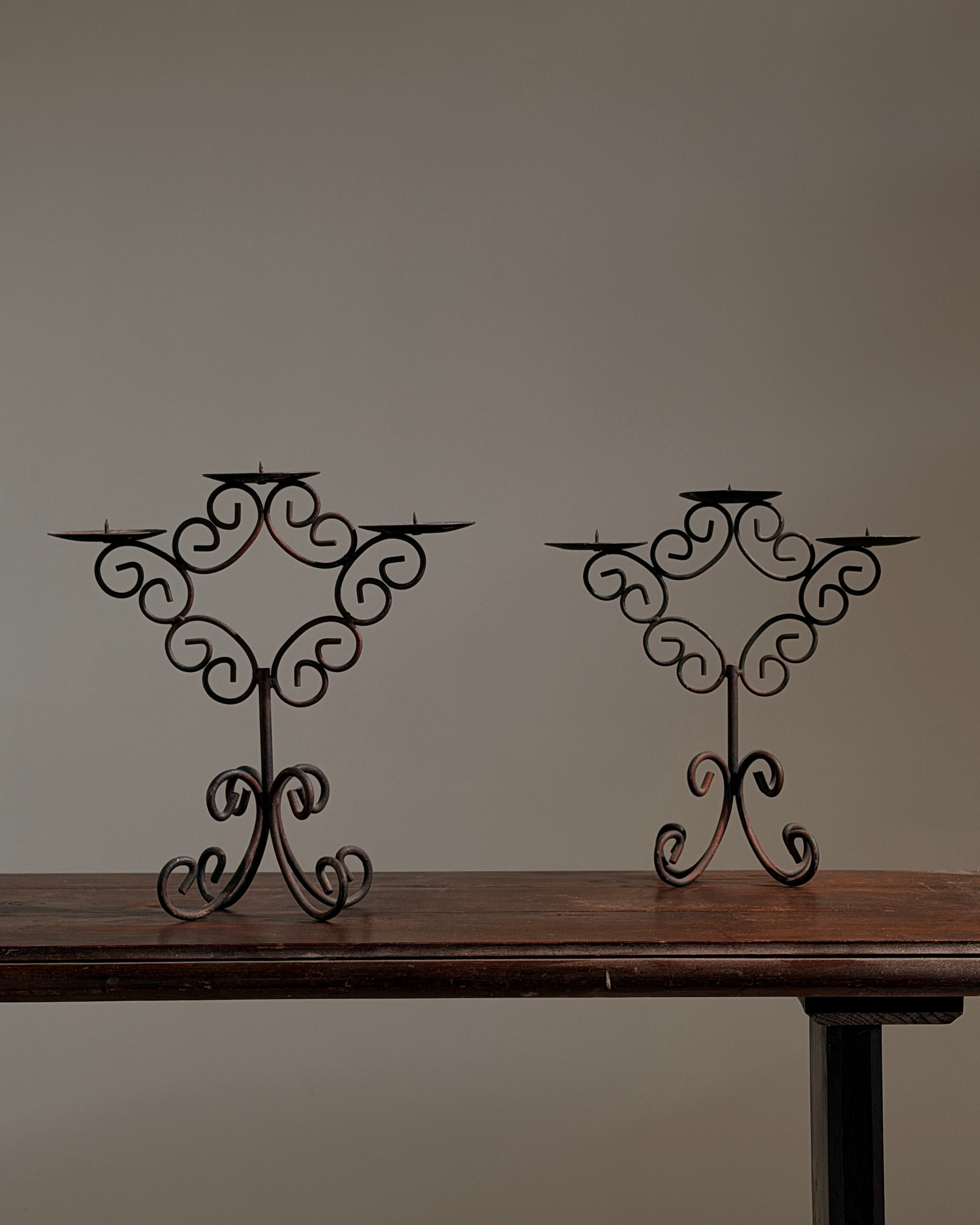 Pair of three-light wrought-iron candleholders, circa 1950 by Figuresdesign | The Oblist