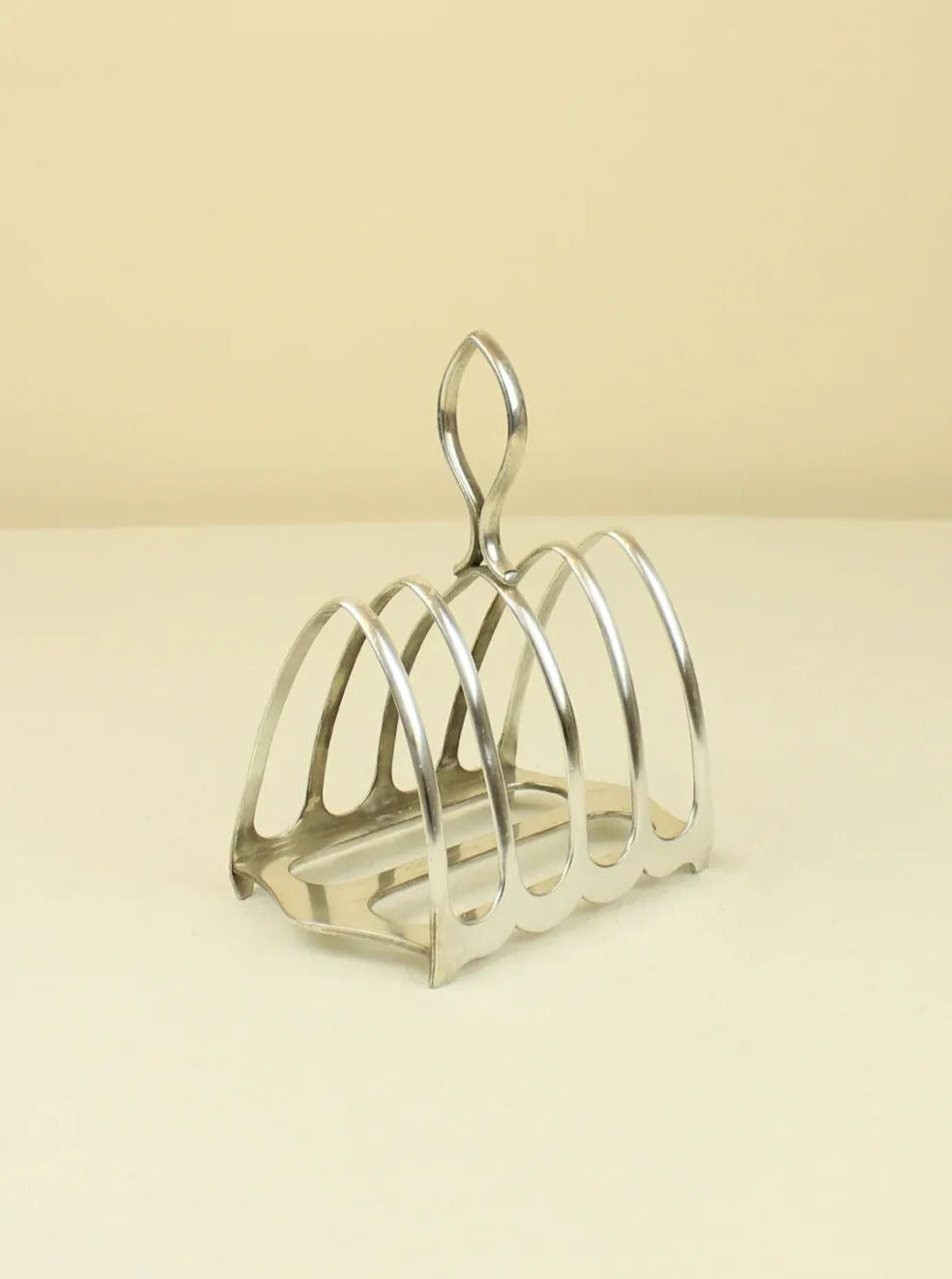 Stylish and practical stainless steel English Toast Holder with wooden base and handle