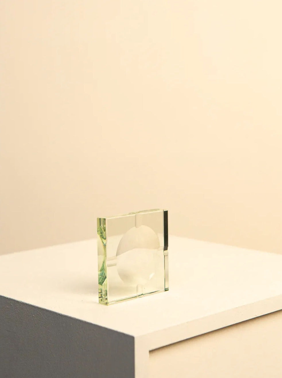 Square glass ashtray by Fontana Arte from the 1960s on a white surface