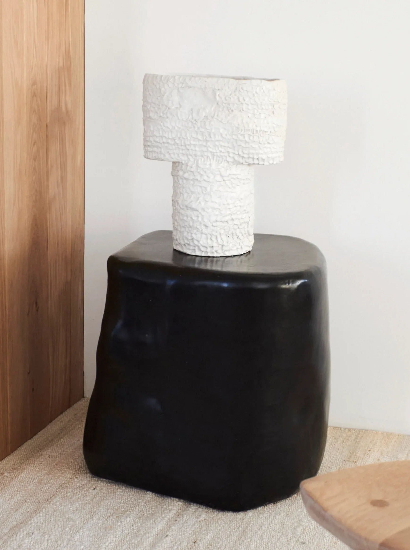 Spacious ceramic side table with a large surface area and sleek design