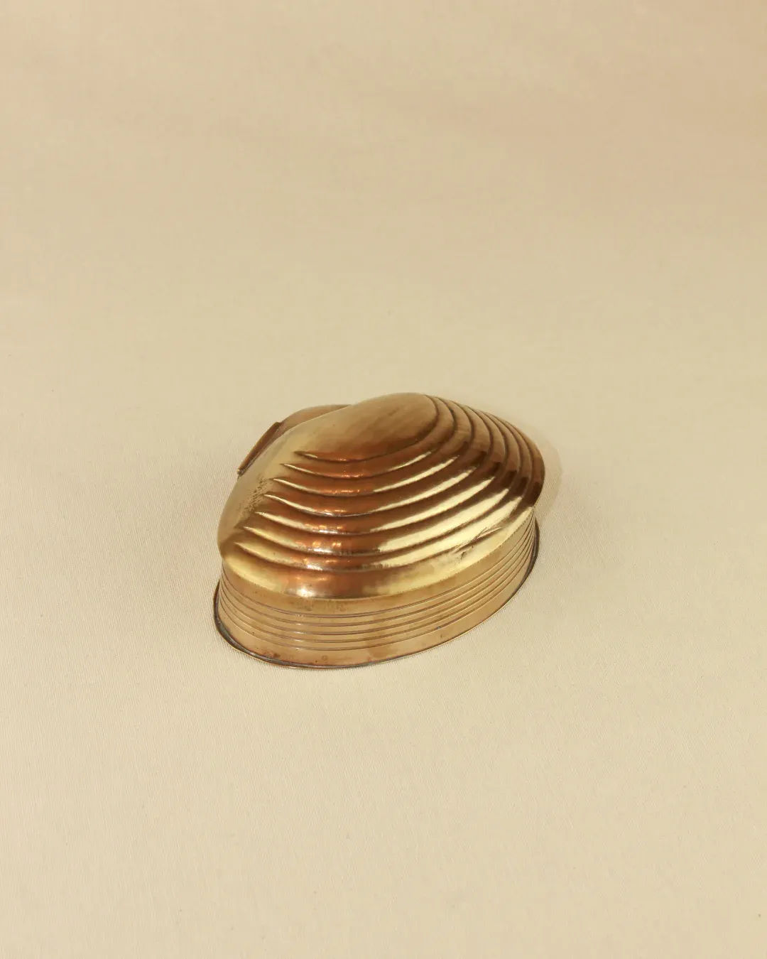 Handcrafted brass shell dish with intricate detailing and polished finish