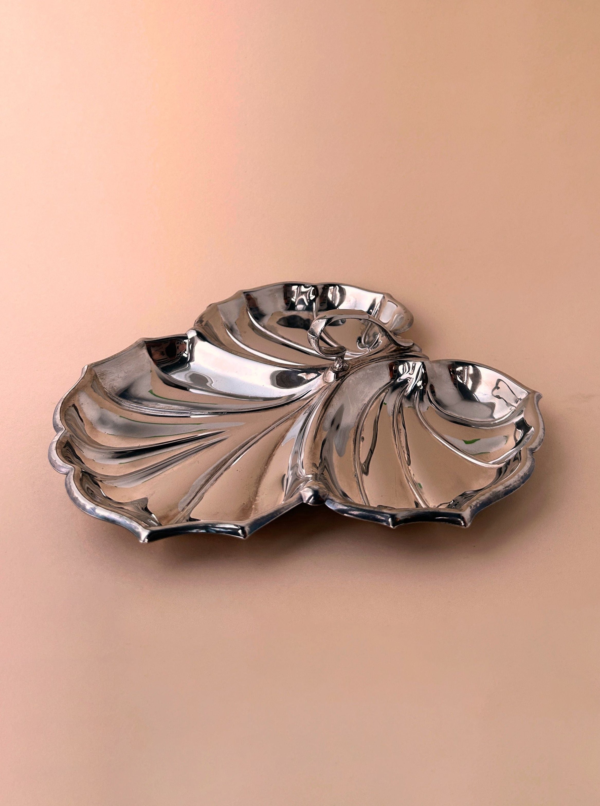 Silver plated shell shaped tender with intricate details and art deco revival style