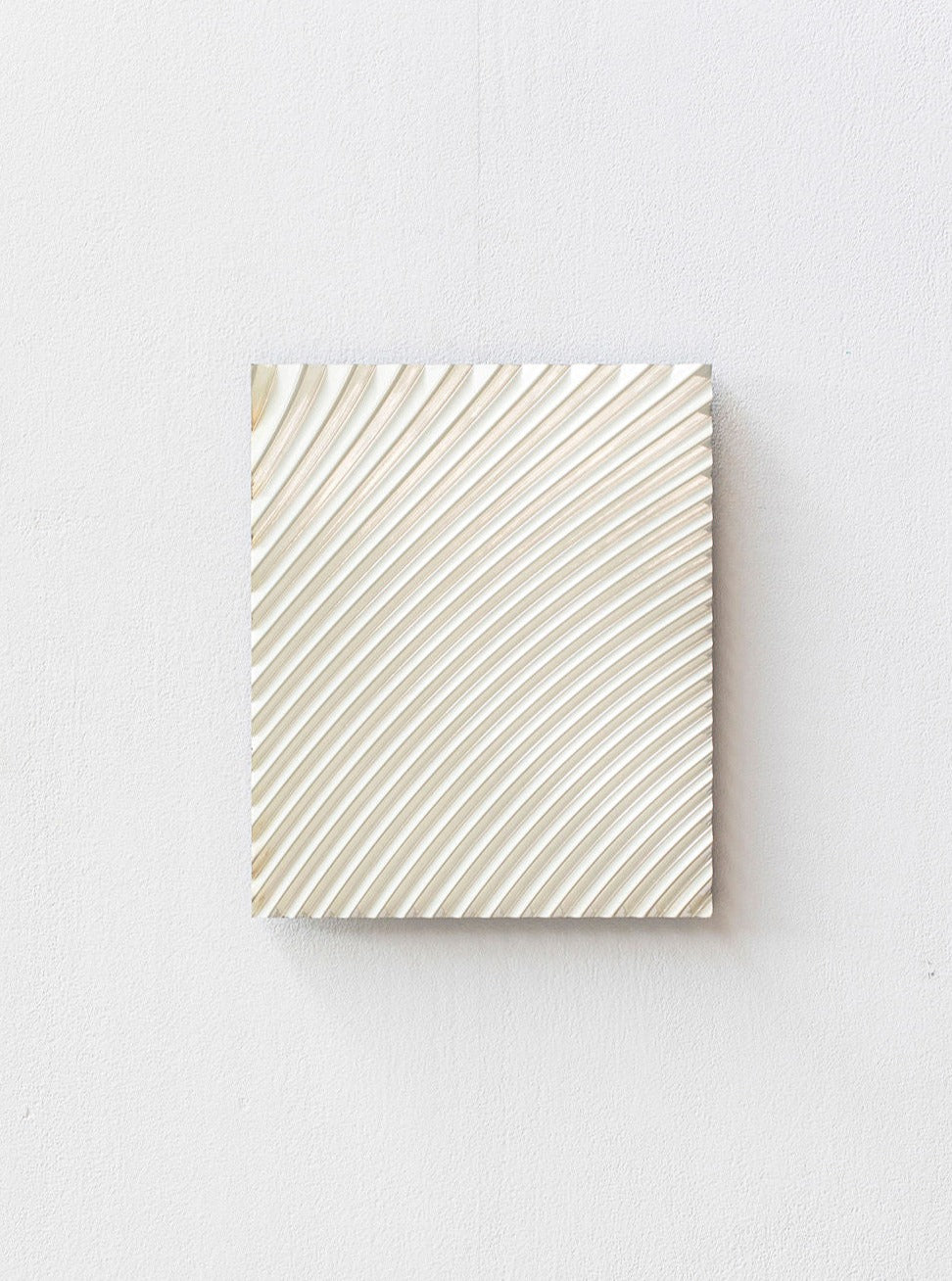 A Wave White Chrome canvas featuring white minimalist curves on a textured surface, mounted on a Studio Arno Hoogland wall panel. The artworkâs subtle lines create a sense of gentle movement and depth.