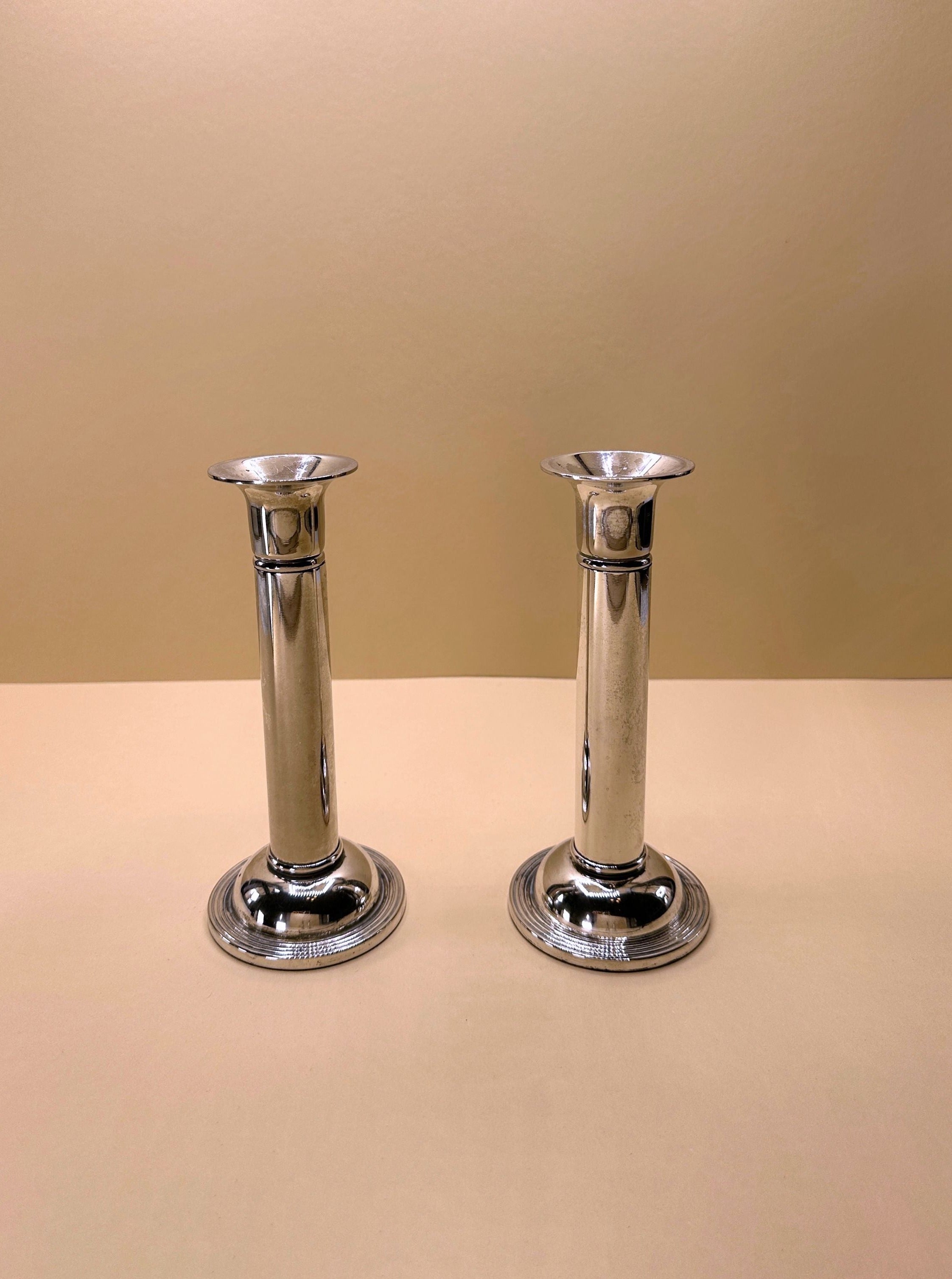 Pair of Silver-Plated Candleholders with Intricate Filigree and Elegant Design