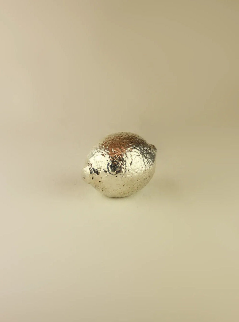 Exquisite silver lime sculpture with intricate details and smooth texture