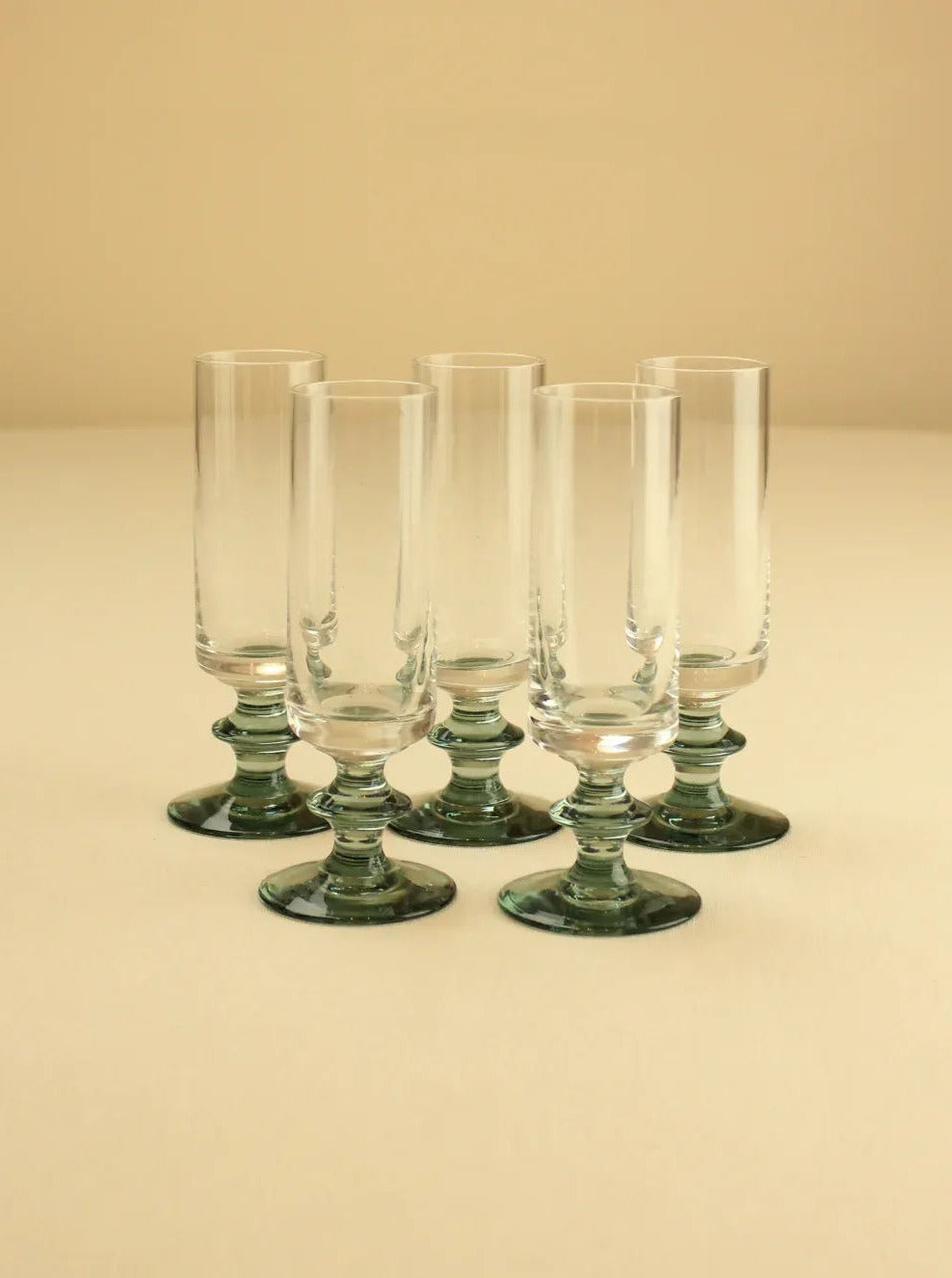 Liquor cups set with elegant design and gold rim