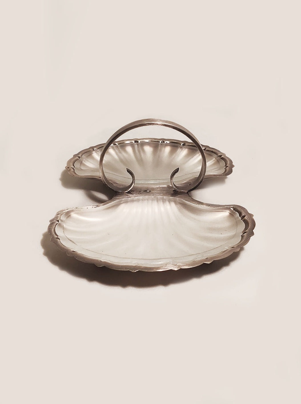 Double shell-shaped serving tray with gold accents and intricate design