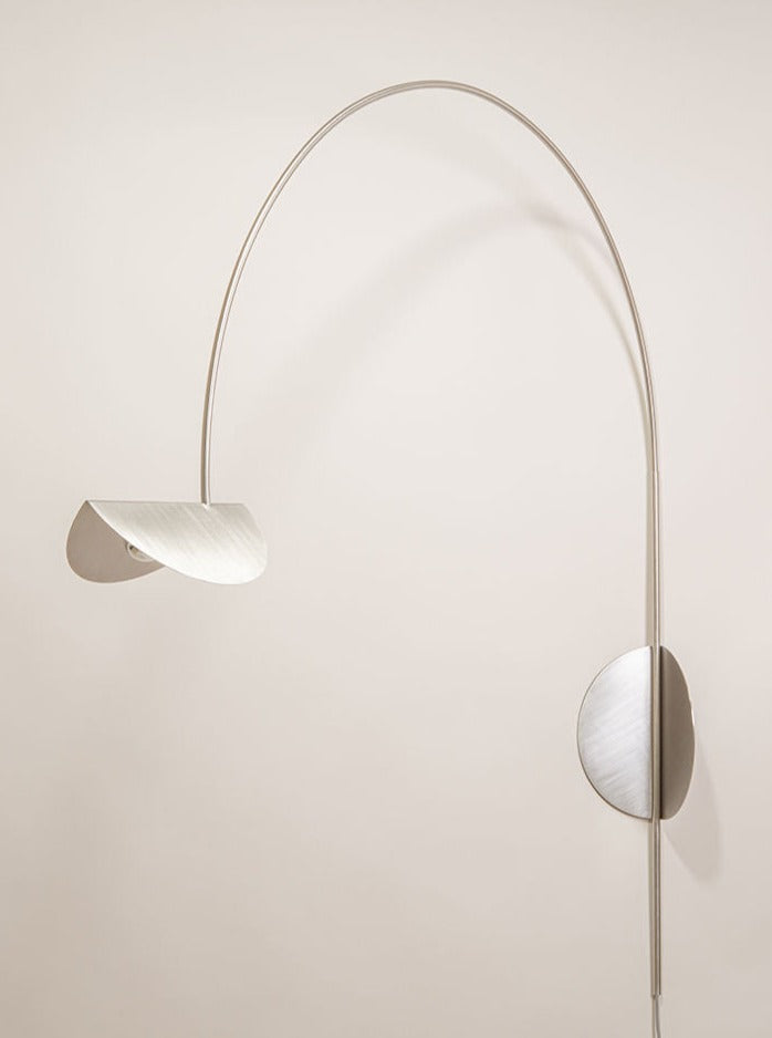 Modern black metal wall lamp with adjustable arm and cone-shaped shade