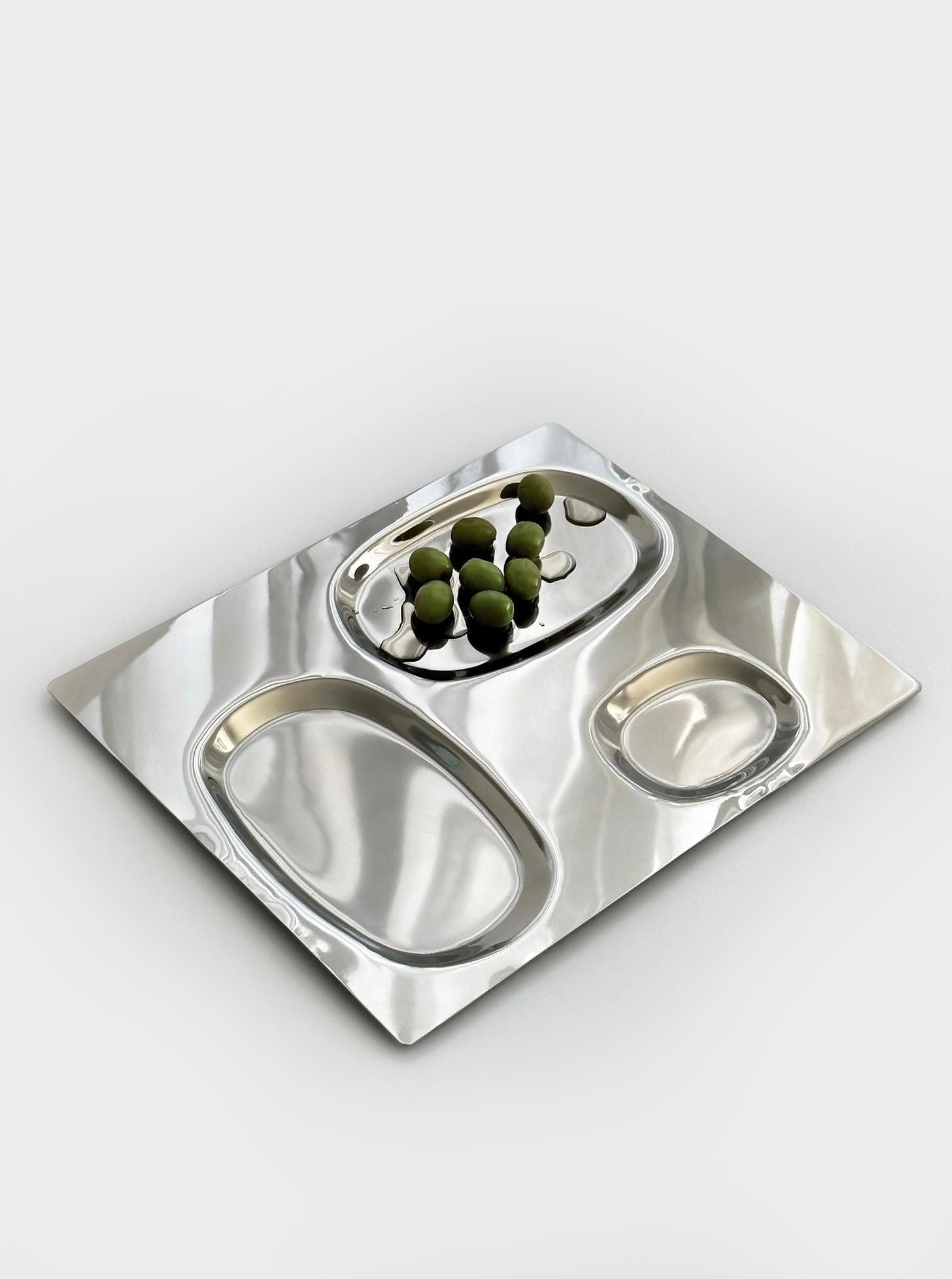 Stainless steel serving dish with elegant curved handles and mirror finish