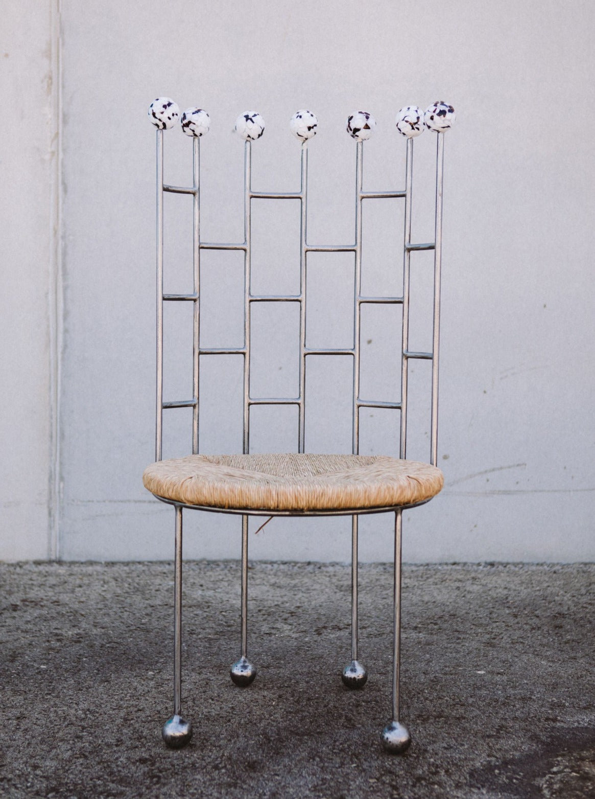 Modern cactus-shaped chair with green velvet upholstery and gold legs