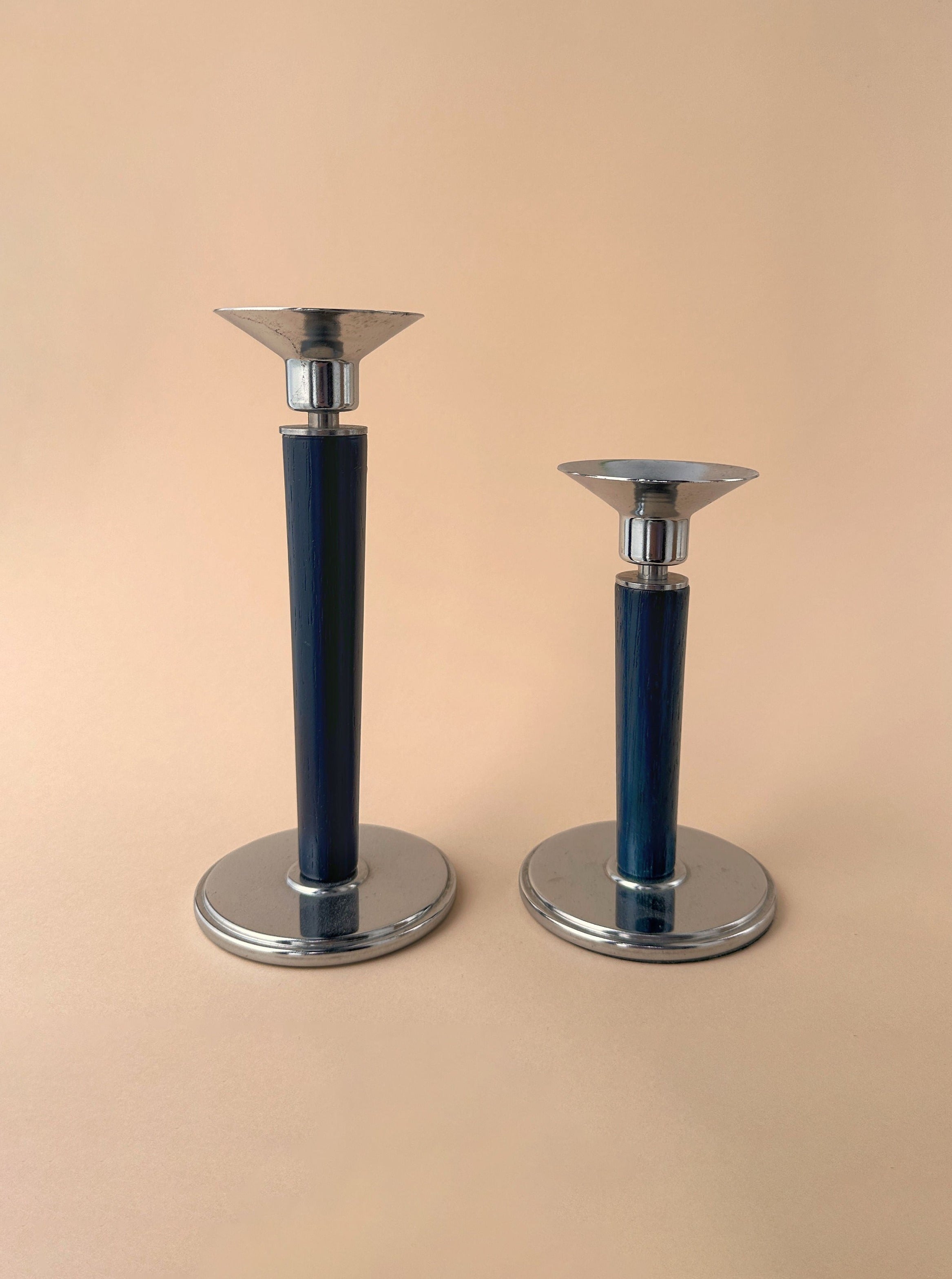 Two Set of 2 Postmodern Candleholders in turquoise color with silver bases and tops on a beige background by Dodo Vintage.