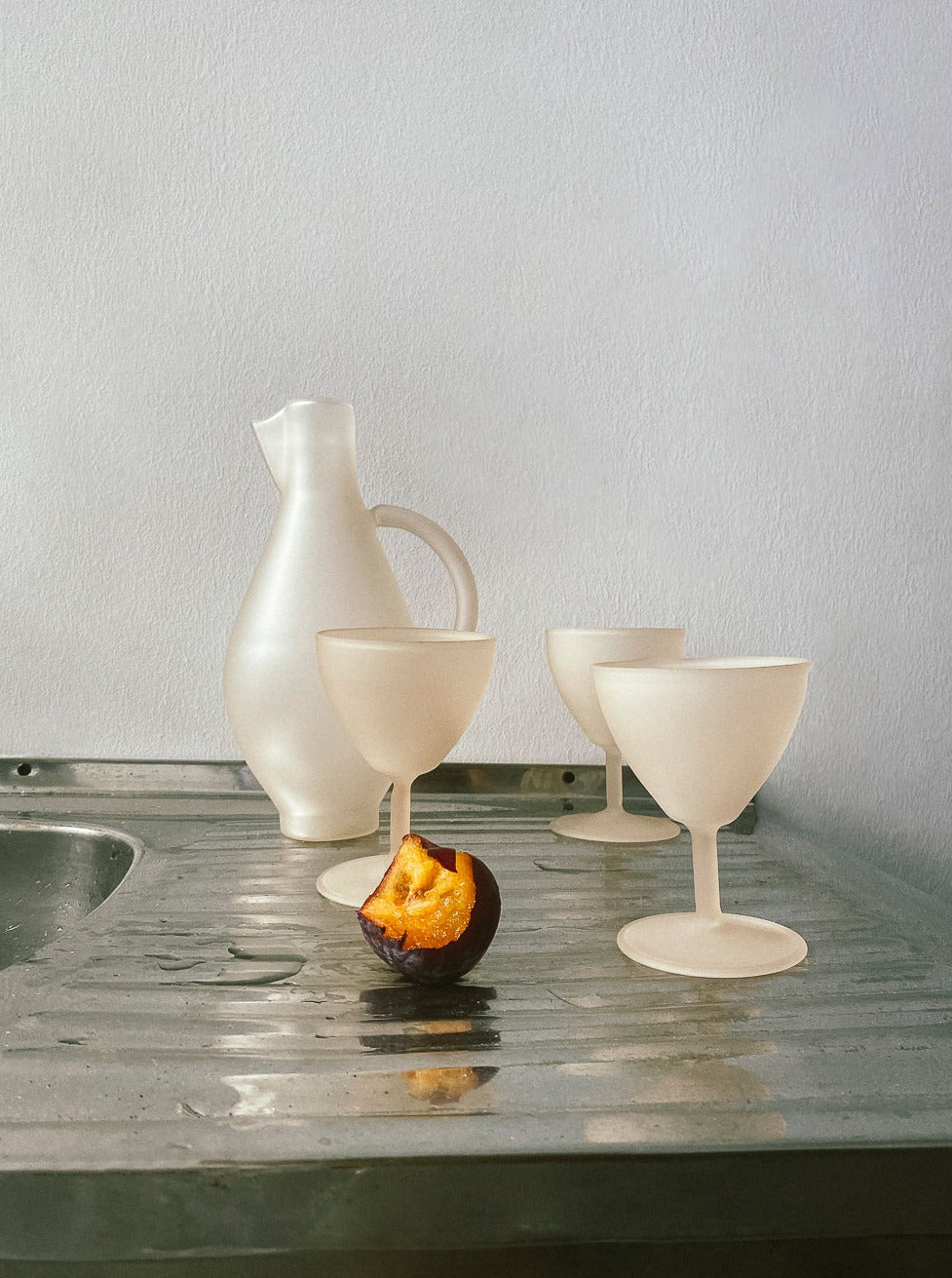 Handcrafted ceramic pitcher set in elegant ecru color with delicate detailing