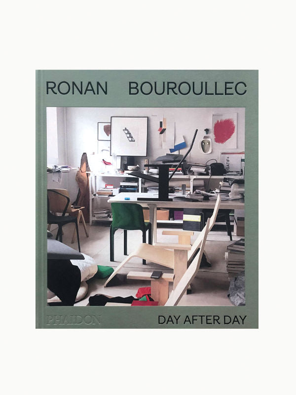 Cover of the book "Ronan Bouroullec: Day After Day" by Maison Plage, featuring a photo of a cluttered design studio with various furniture pieces and sketches that capture the creative mind at work.