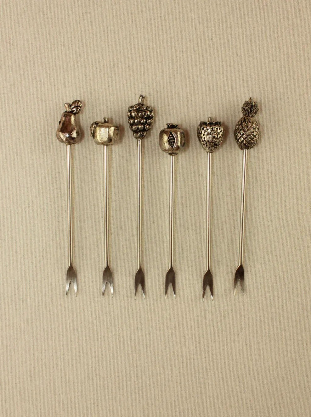 Set of six stainless steel appetizer skewers with colorful handles