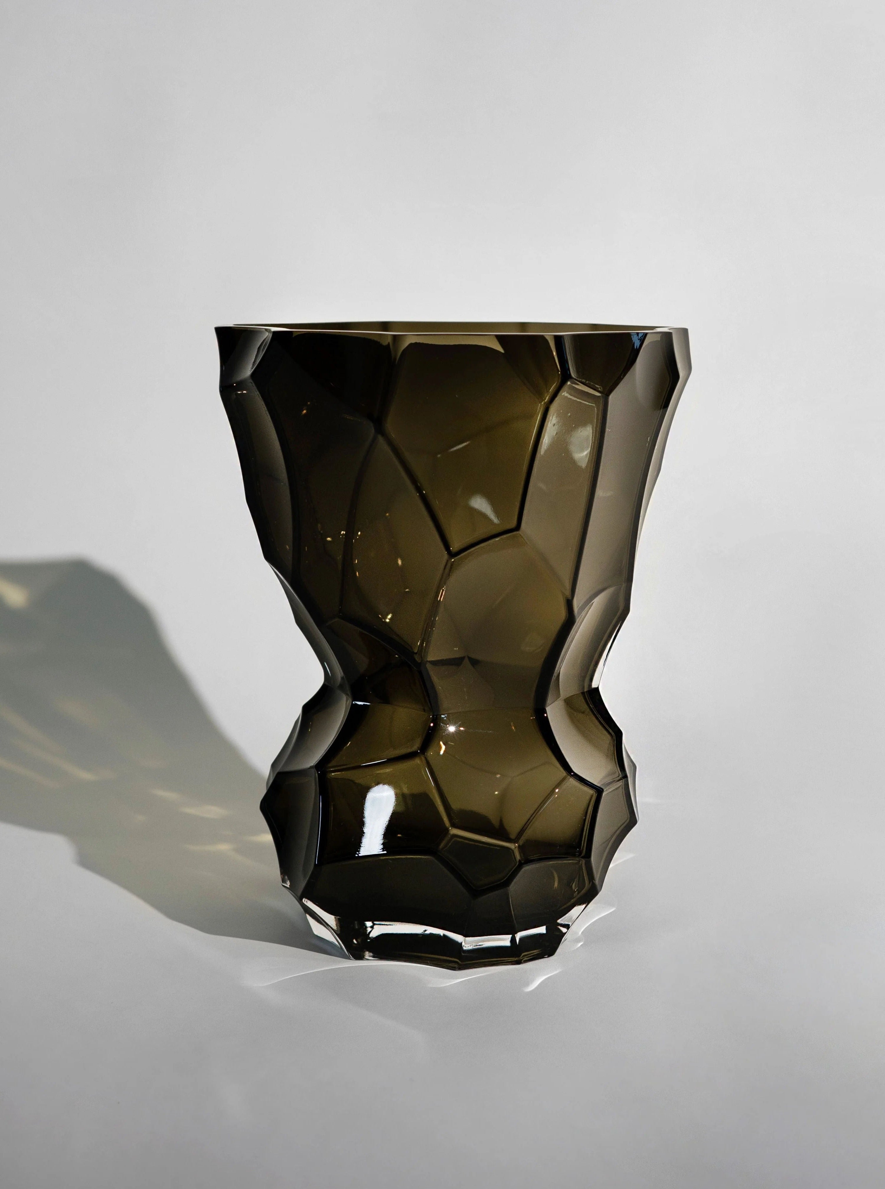 Handcrafted glass vase in a smoky grey hue, perfect for adding a sophisticated touch to any interior decor